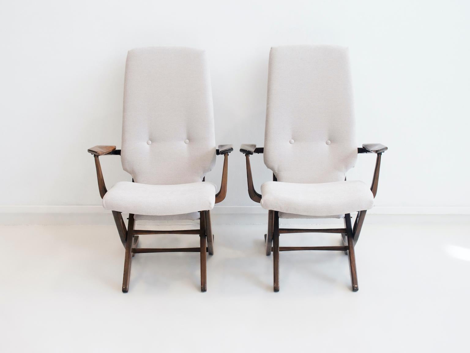 Pair of armchairs with high back in varnished exotic wood. With adjustable recliner back. Recently reupholstered in light grey fabric.