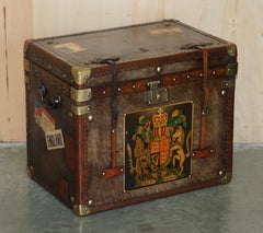 PAIR OF ARMORIAL COAT OF ARMS VINTAGE BROWN LEATHER STEAMER TRUNK SIDE TABLEs
