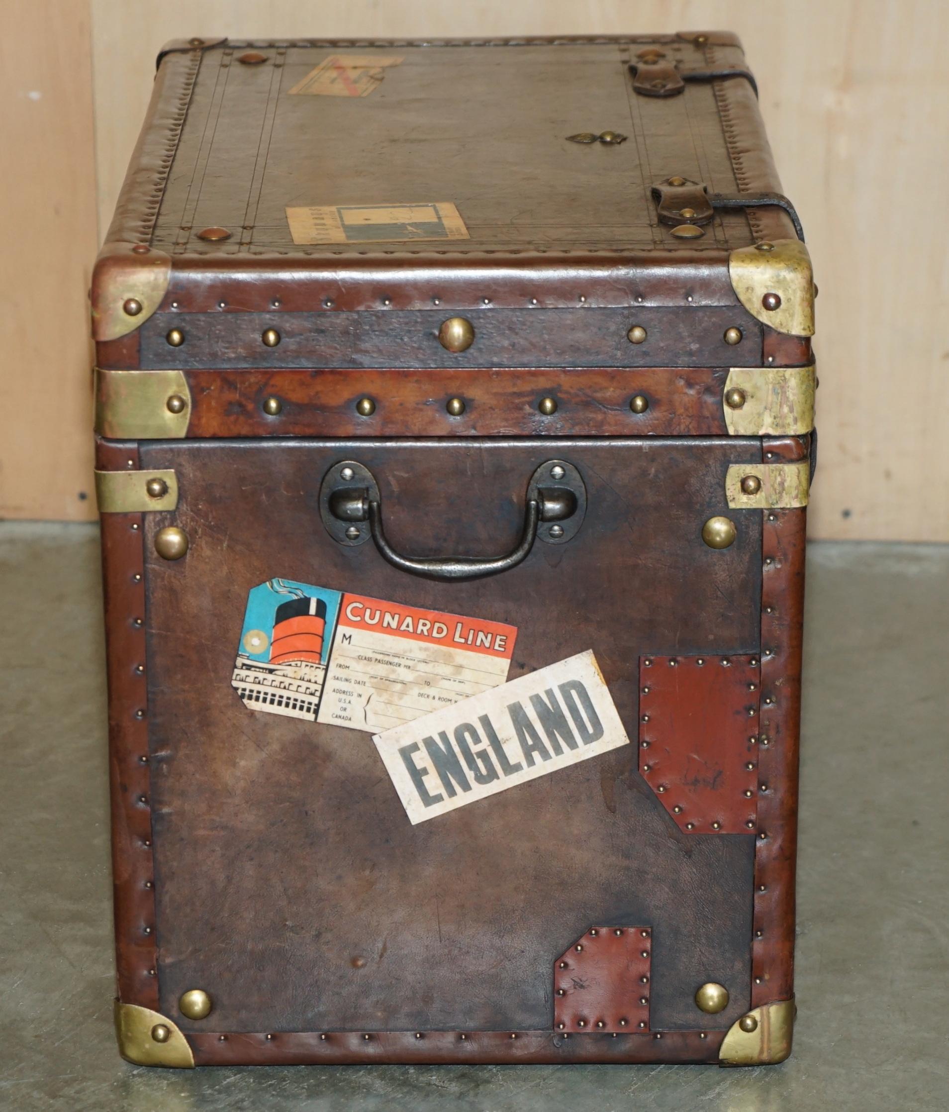 20th Century PAIR OF ARMORIAL COAT OF ARMS VINTAGE BROWN LEATHER STEAMER TRUNK SIDE TABLEs For Sale