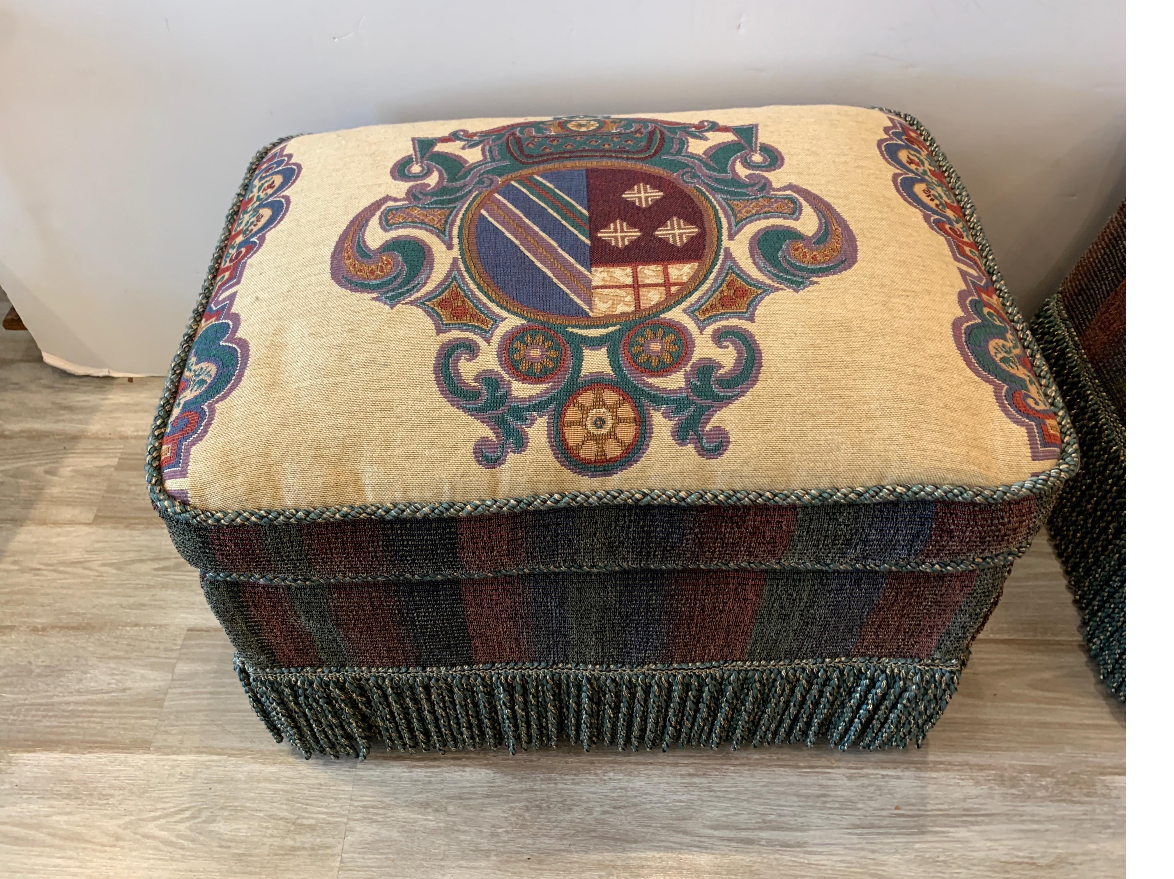 Pair of Armorial Upholstered Ottomans with Bouillon Fringe In Excellent Condition In Lambertville, NJ