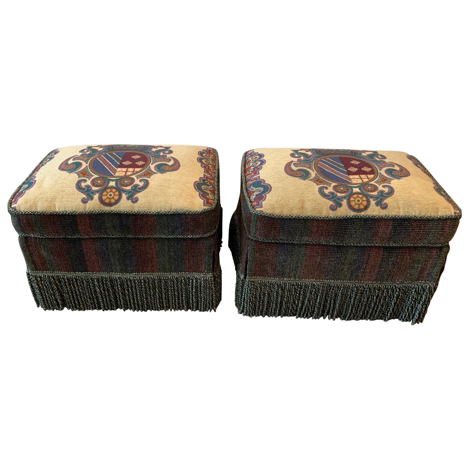 Pair of Armorial Upholstered Ottomans with Bouillon Fringe