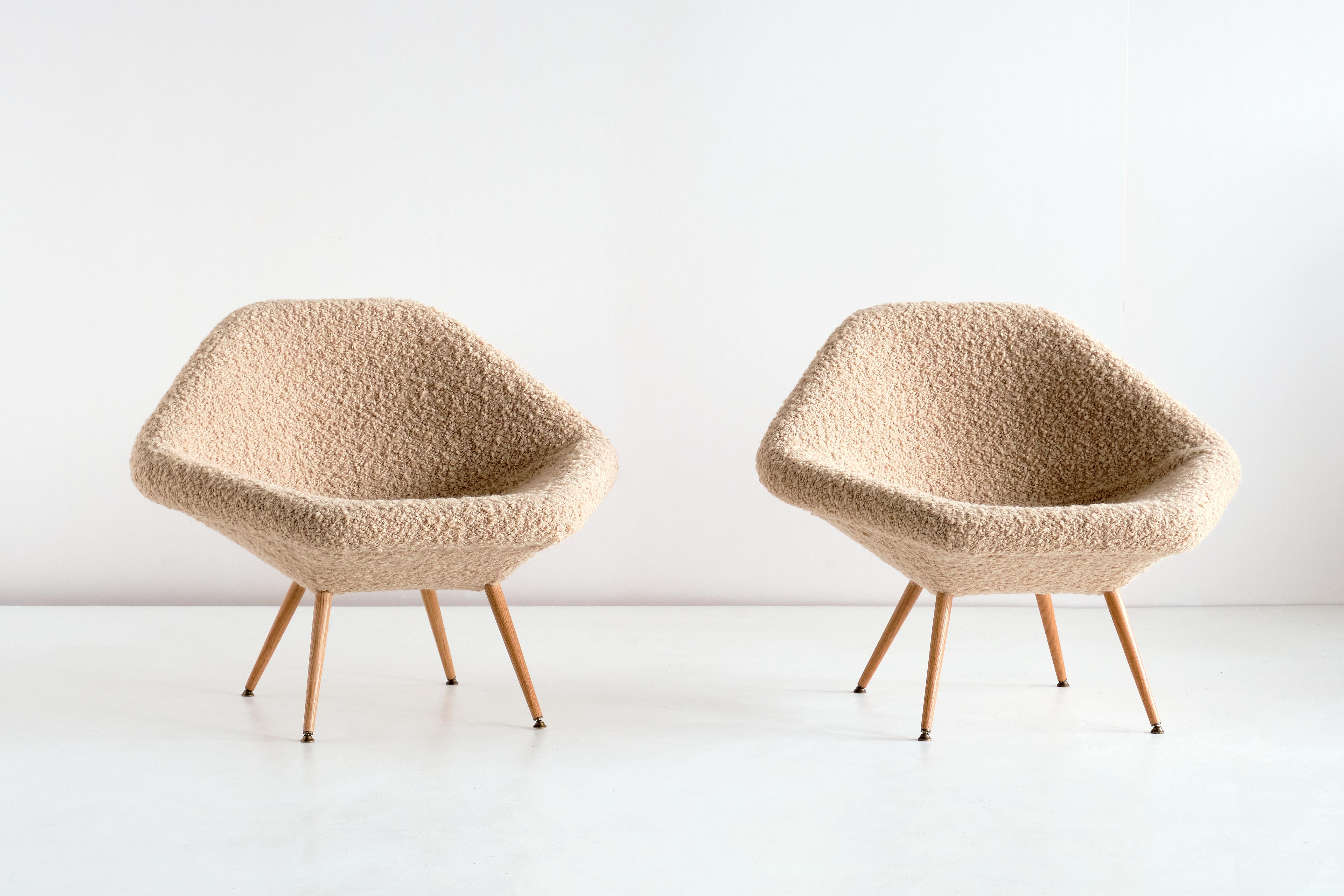 This rare pair of lounge chairs was designed by Arne Dahlén in the early 1960s. The model was called 'Eva' and was manufactured by his company, Dahléns Company in the Swedish town Dalum. The company was solely devoted to the production of