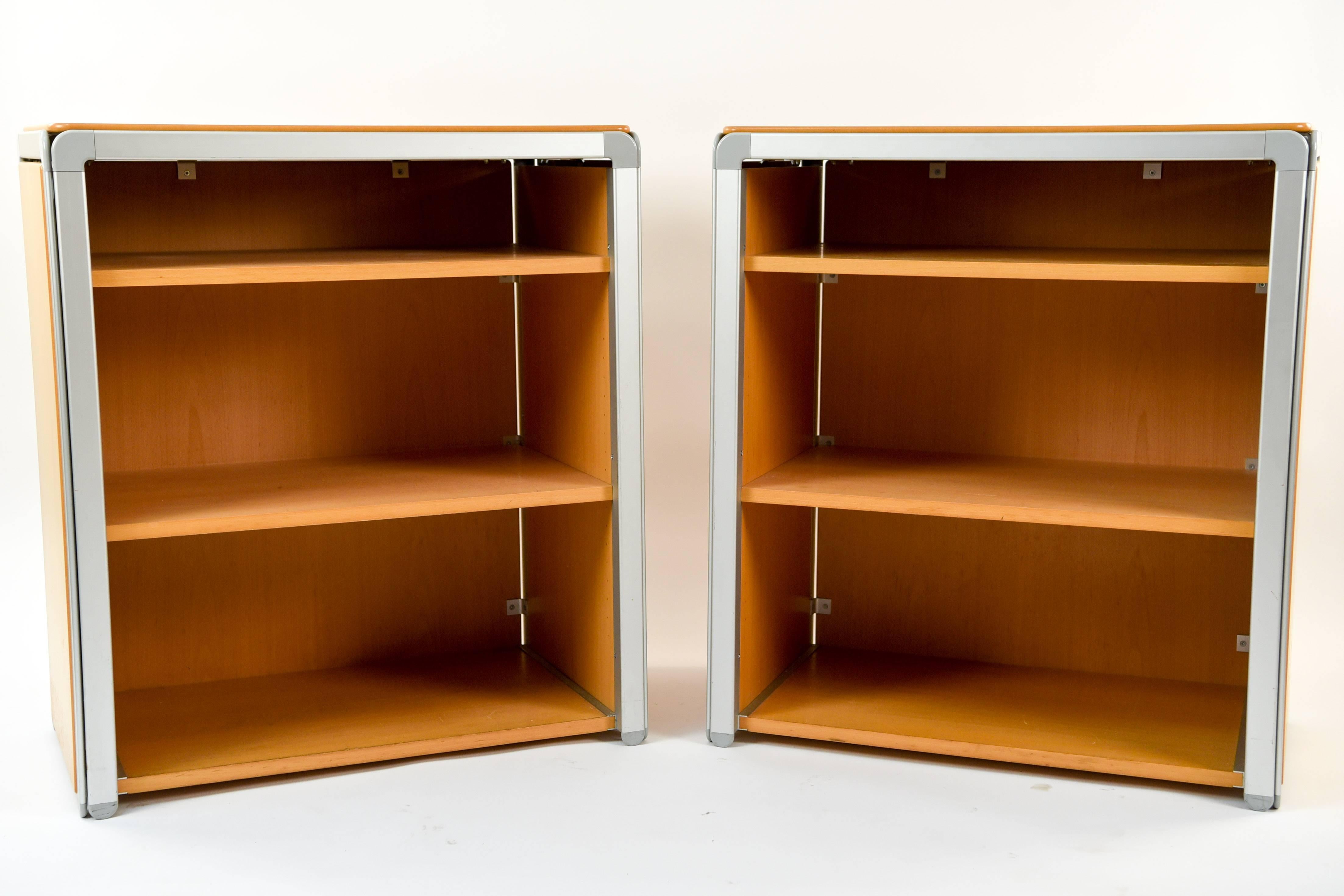 The bookcases were part of one of Arne Jacobsen's last large projects. Designed in 1971 for Denmark Nationalbank, this pair was part of the DJOB series and features aluminium outlines with beech wood as the sides and shelves. These would be great