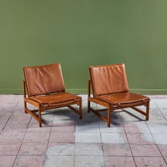 Ein Paar Loungesessel aus Leder und Schilfrohr von Arne Karlsen und Peter Hjort