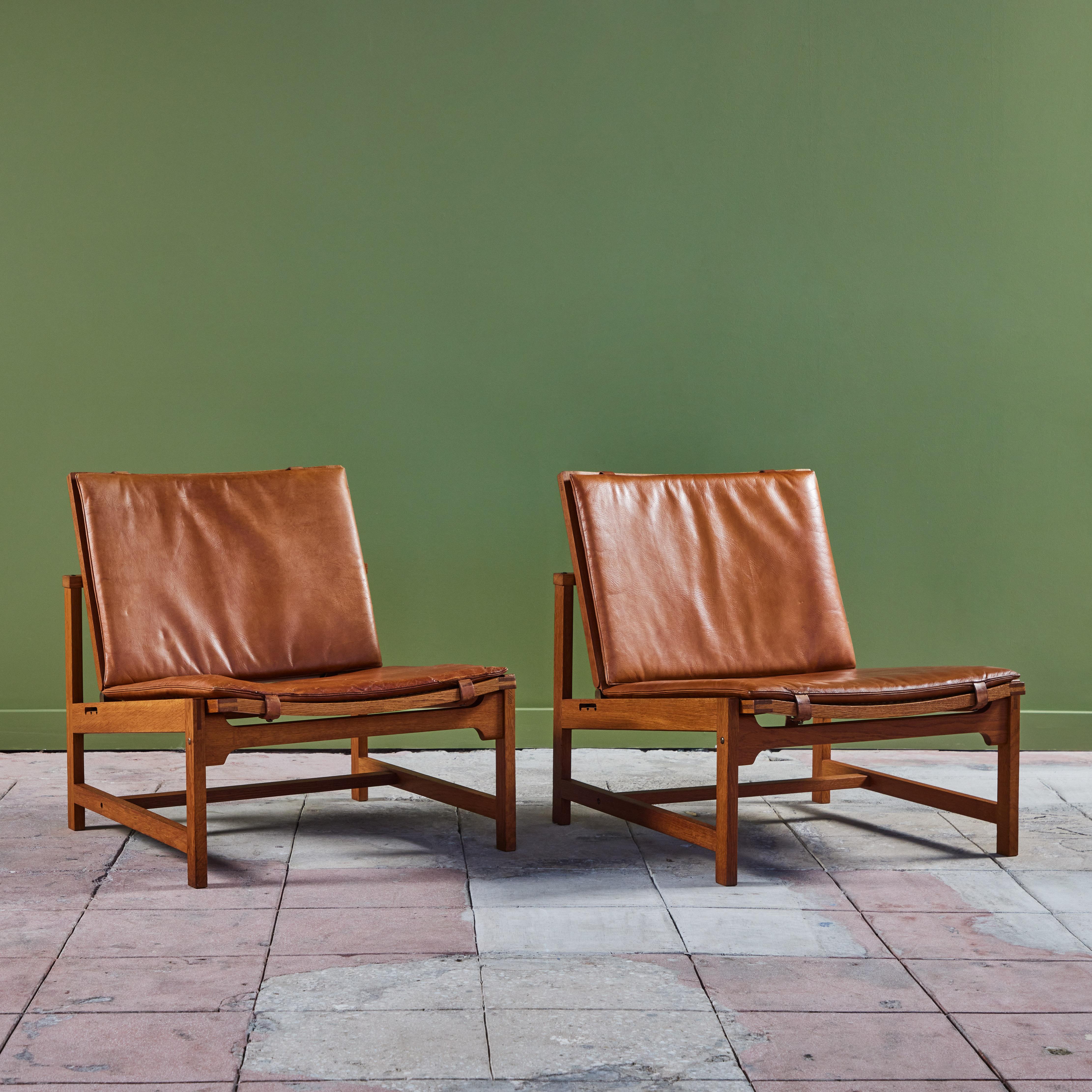 Mid-Century Modern Pair of Arne Karlsen and Peter Hjort Leather and Cane Lounge Chairs