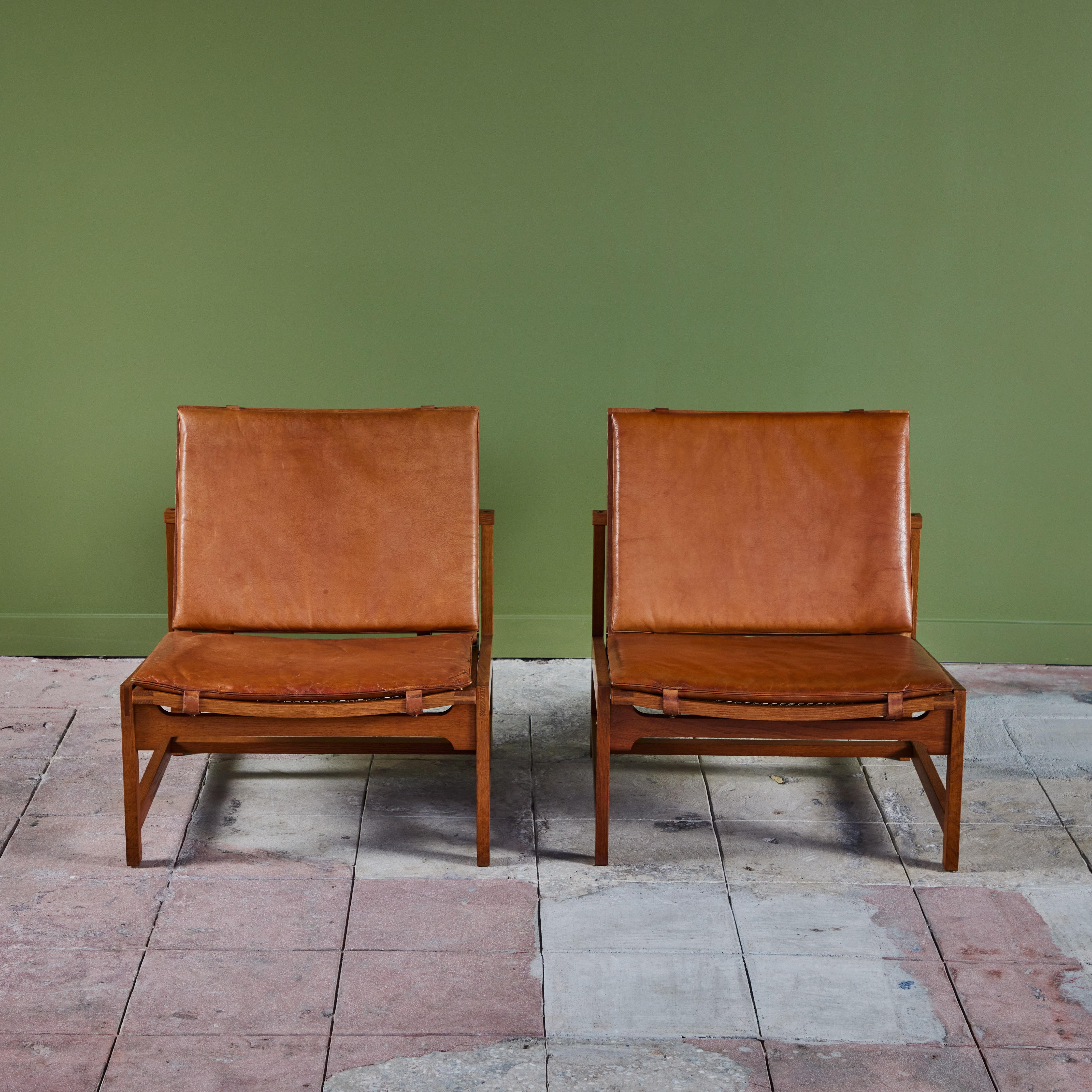Danish Pair of Arne Karlsen and Peter Hjort Leather and Cane Lounge Chairs