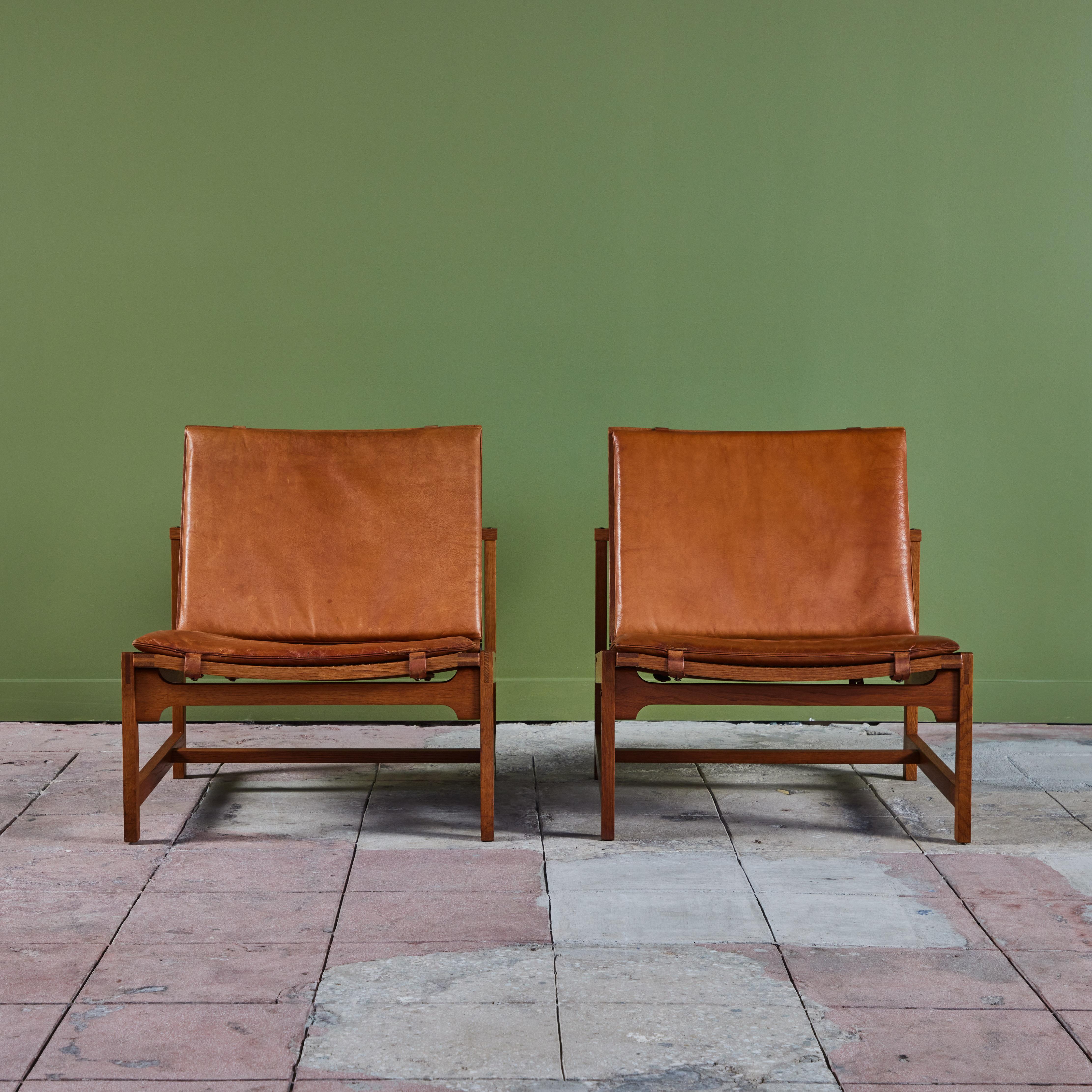 Pair of Arne Karlsen and Peter Hjort Leather and Cane Lounge Chairs In Good Condition In Los Angeles, CA