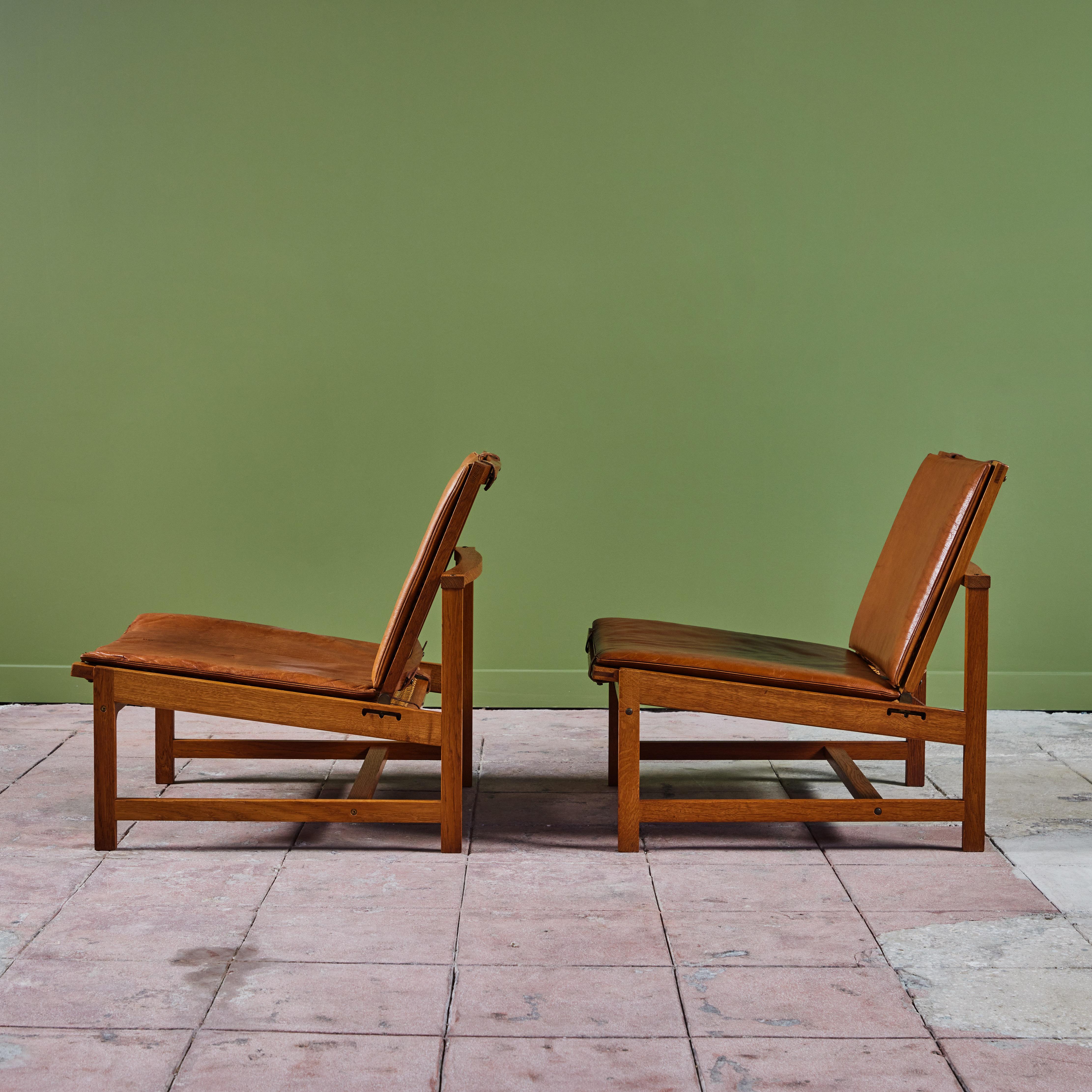 Mid-20th Century Pair of Arne Karlsen and Peter Hjort Leather and Cane Lounge Chairs