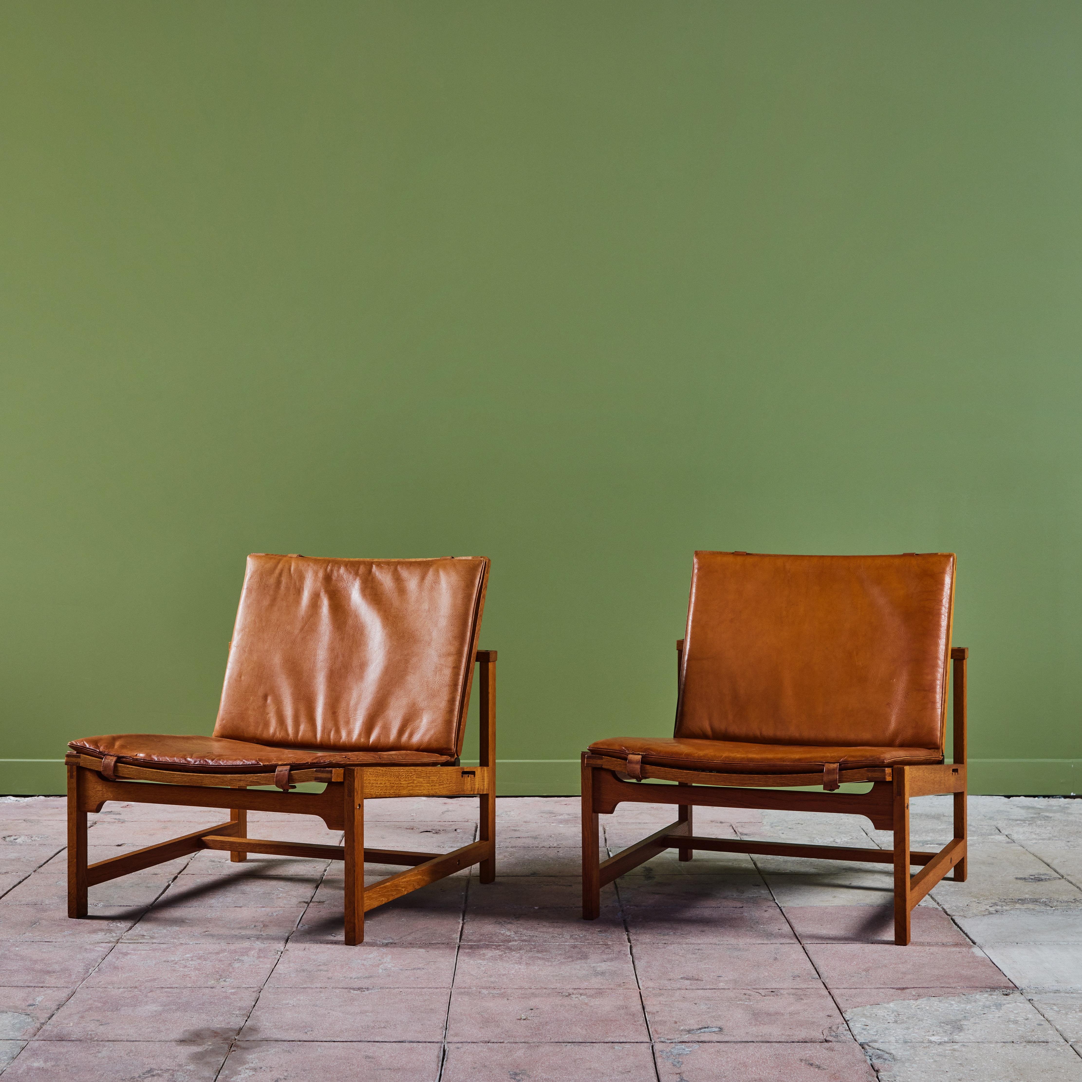 Pair of Arne Karlsen and Peter Hjort Leather and Cane Lounge Chairs 1
