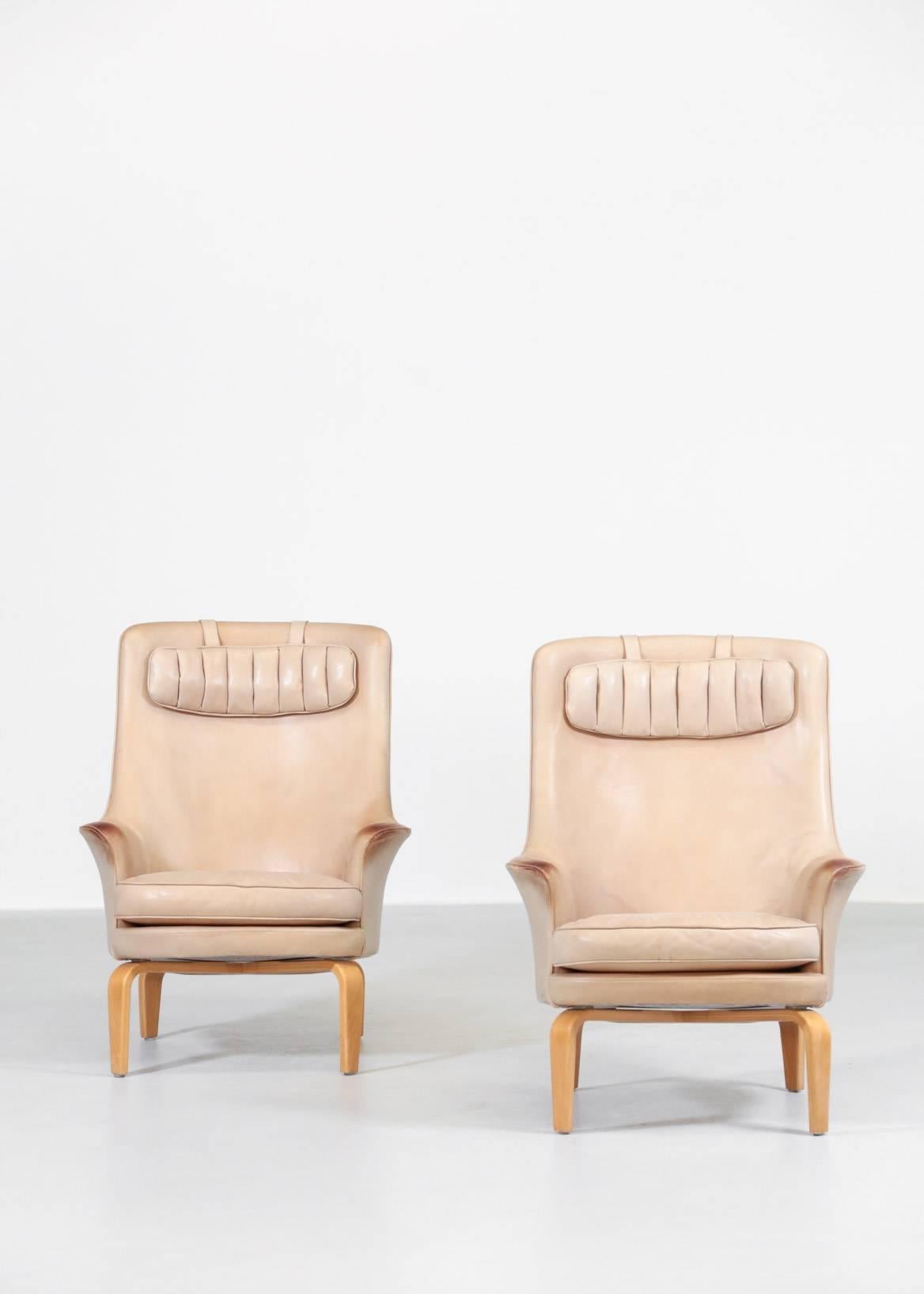 Rare armchairs designed by Arne Norell.
Seat in beige leather with beautiful patina.
Stamp on the seat.