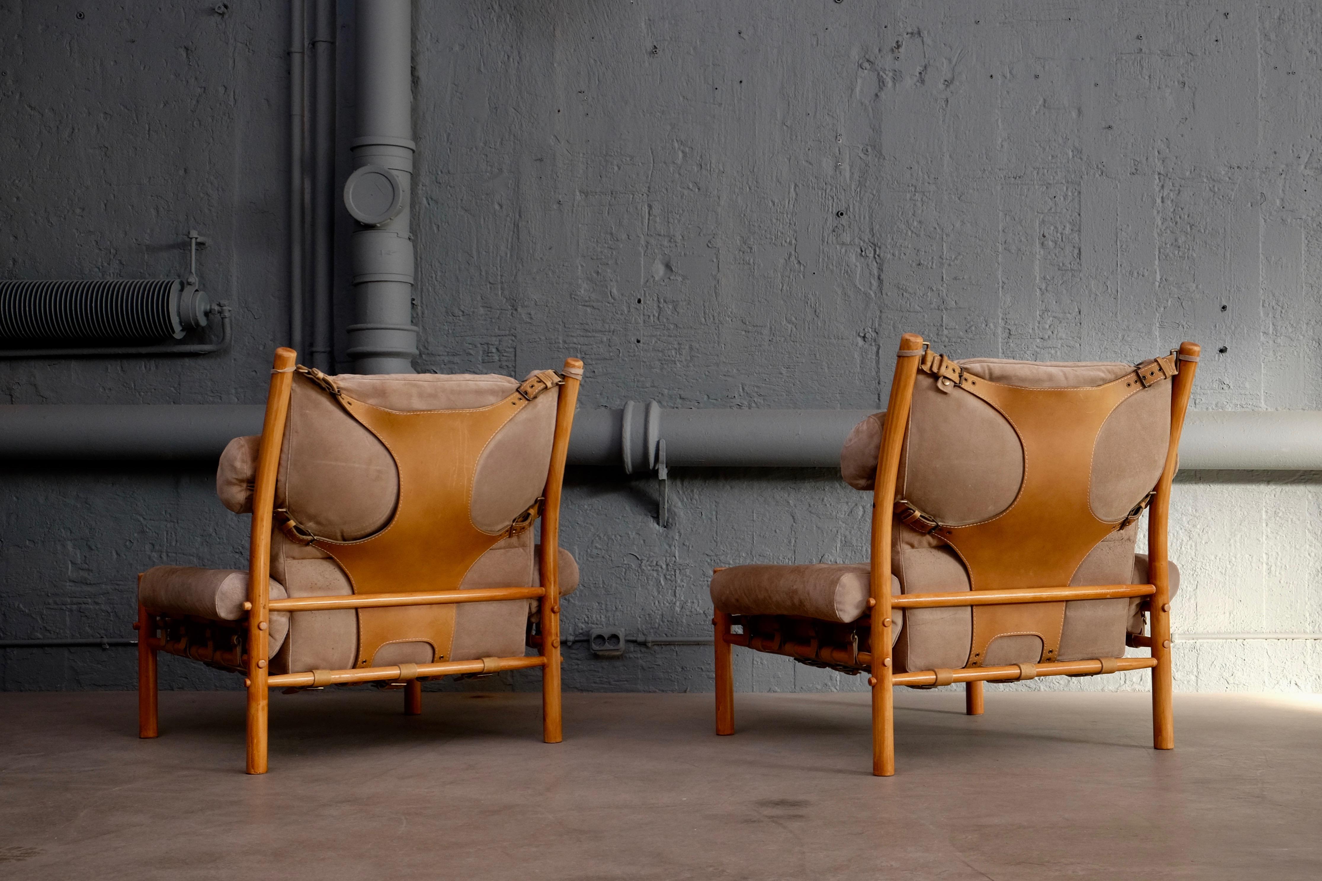 A pair of the very comfortable Inca chairs with ottomans and rare side table. Patinated original suede leather. Designed by Arne Norell, produced by Norell Möbel AB in Aneby, Sweden. Signed.






    