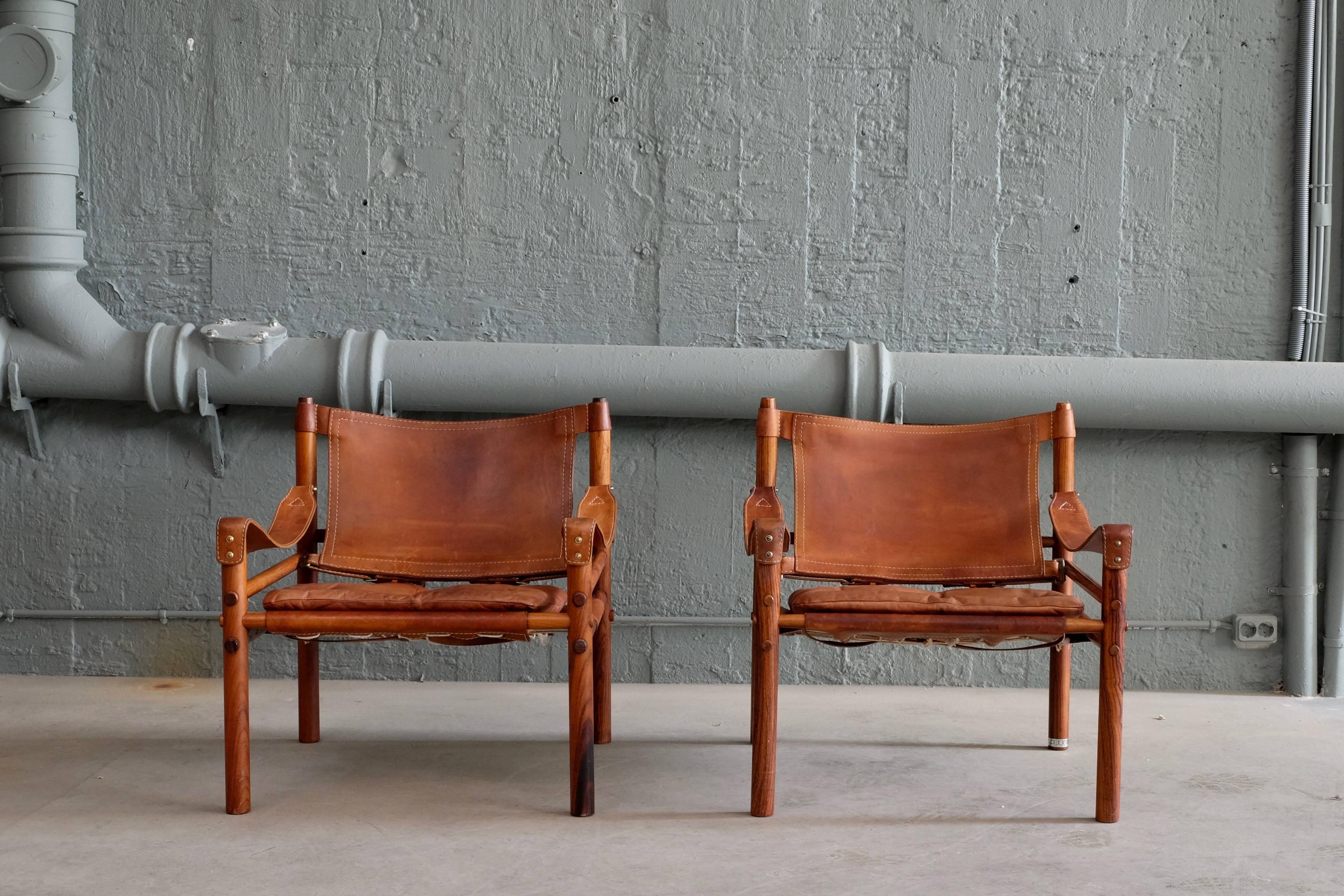 Great pair of easy chairs model Sirocco, 1960s. Designed by Arne Norell, produced by Arne Norell AB in Aneby, Sweden. Brown leather.



 