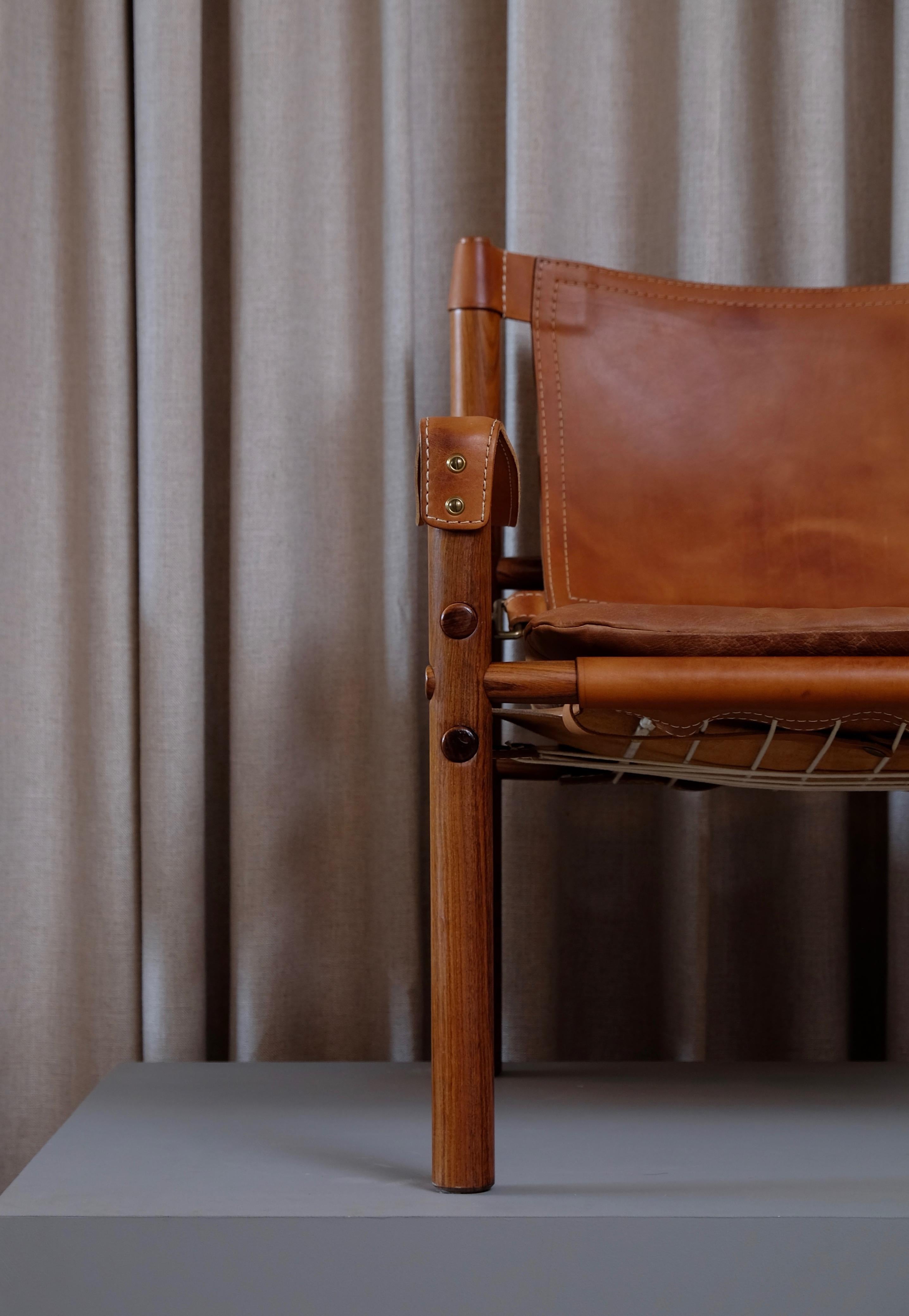 Excellent pair of safari chairs model Sirocco in very good condition. Cognac original brown leather.
Designed by Arne Norell, produced by Arne Norell AB in Aneby, Sweden, 1960s.





 