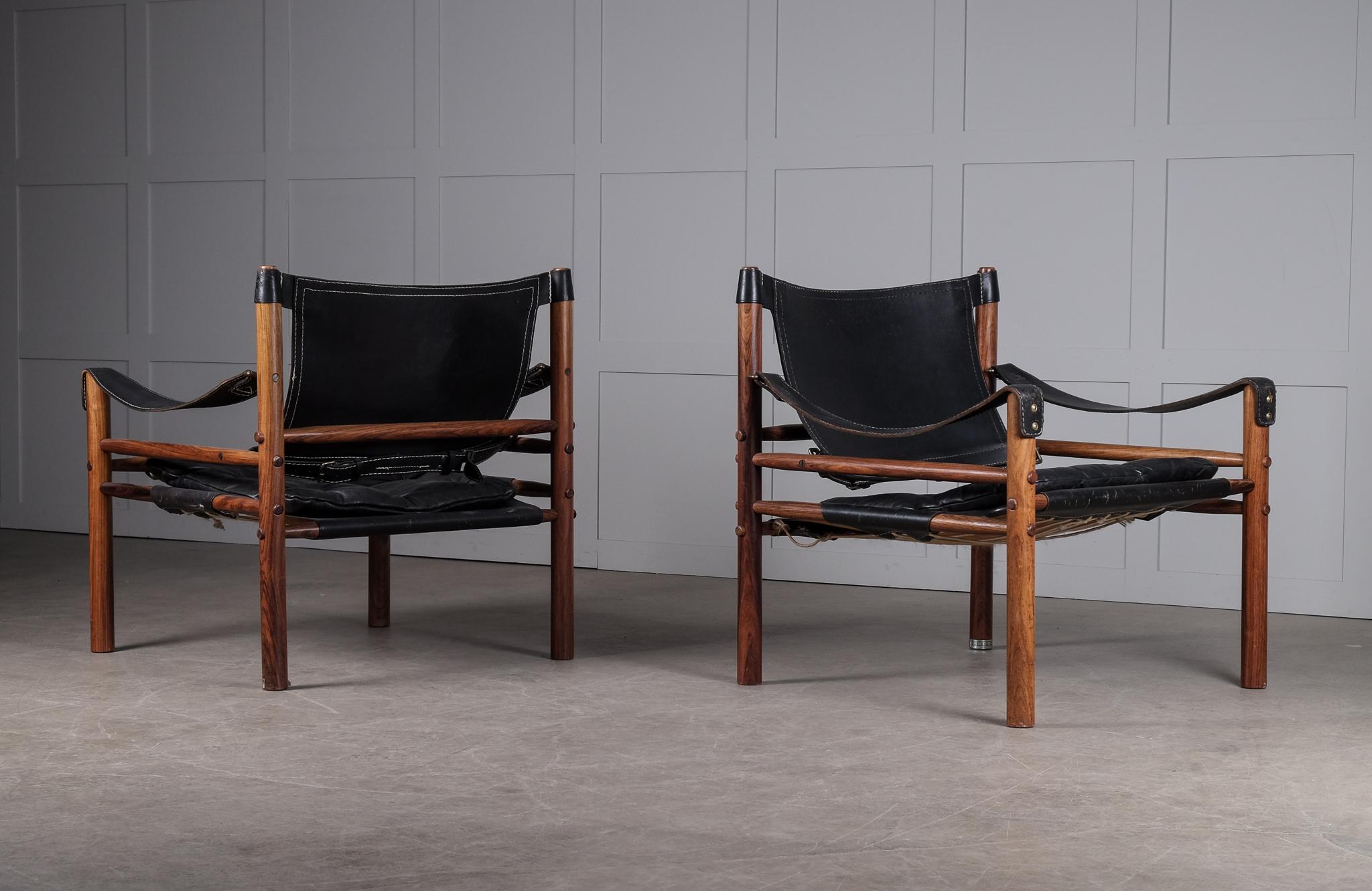 Pair of safari chairs model Sirocco in good condition with original black leather.
Designed by Arne Norell, produced by Arne Norell AB in Aneby, Sweden, 1960s.
  




  