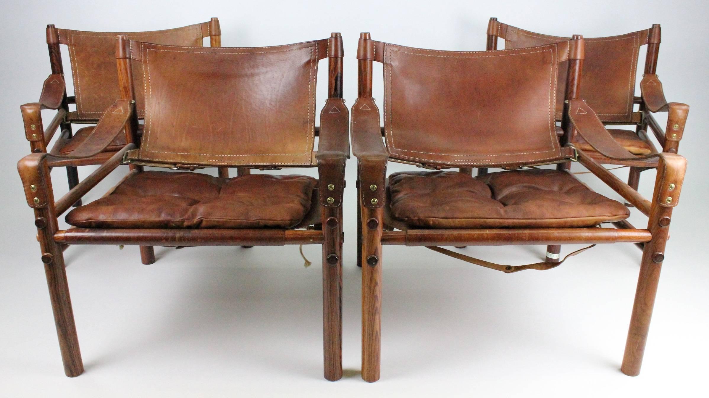 Two pairs of Sirocco Safari chairs. Price is for one pair but two pairs are available. These four Safari chairs have been together for 40 years standing together in the same room. They have the same color and patina. All four looks very much alike!