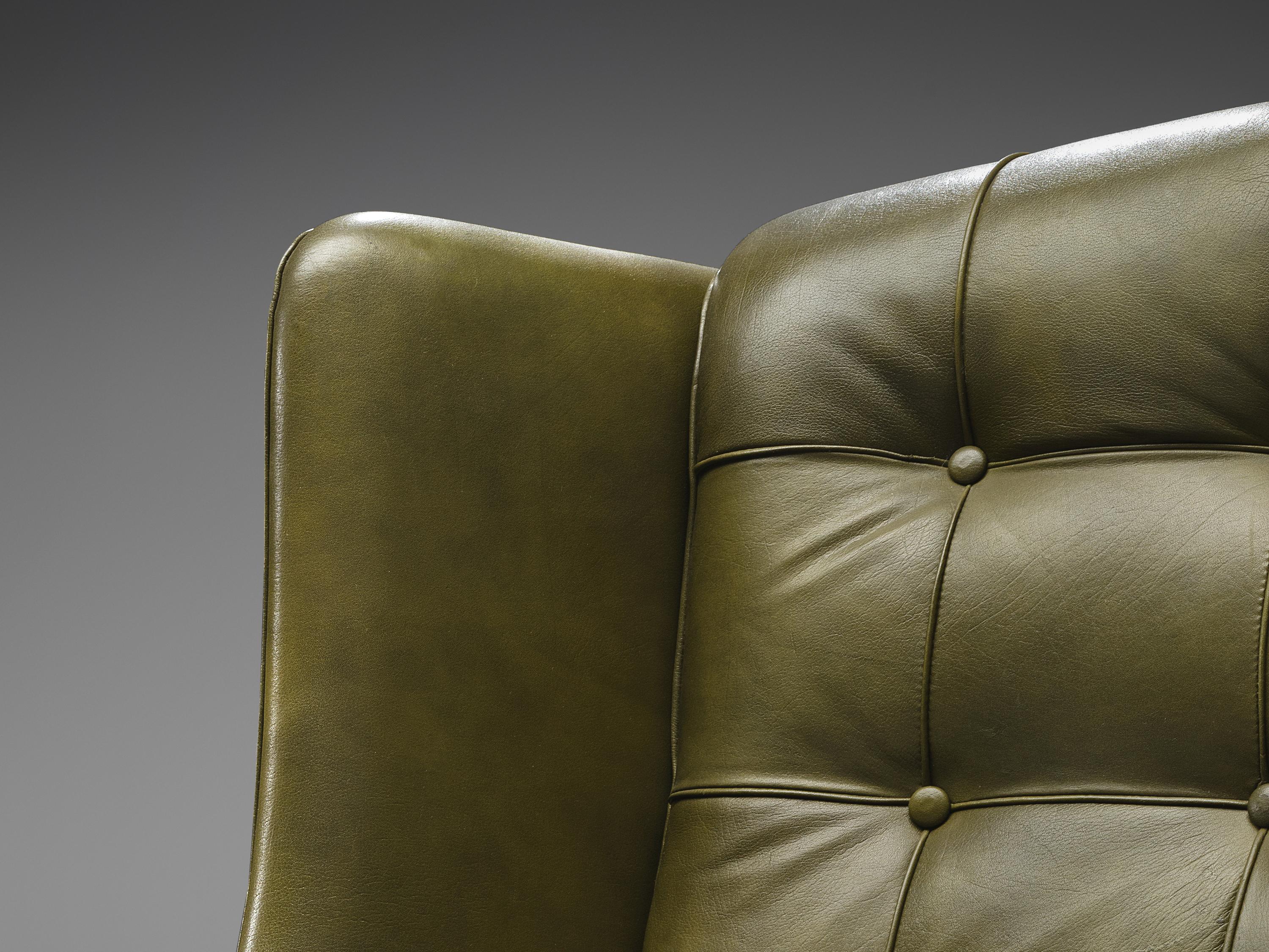 Scandinavian Modern Pair of Arne Norell Lounge Chairs in Patinated Green and Cognac Leather