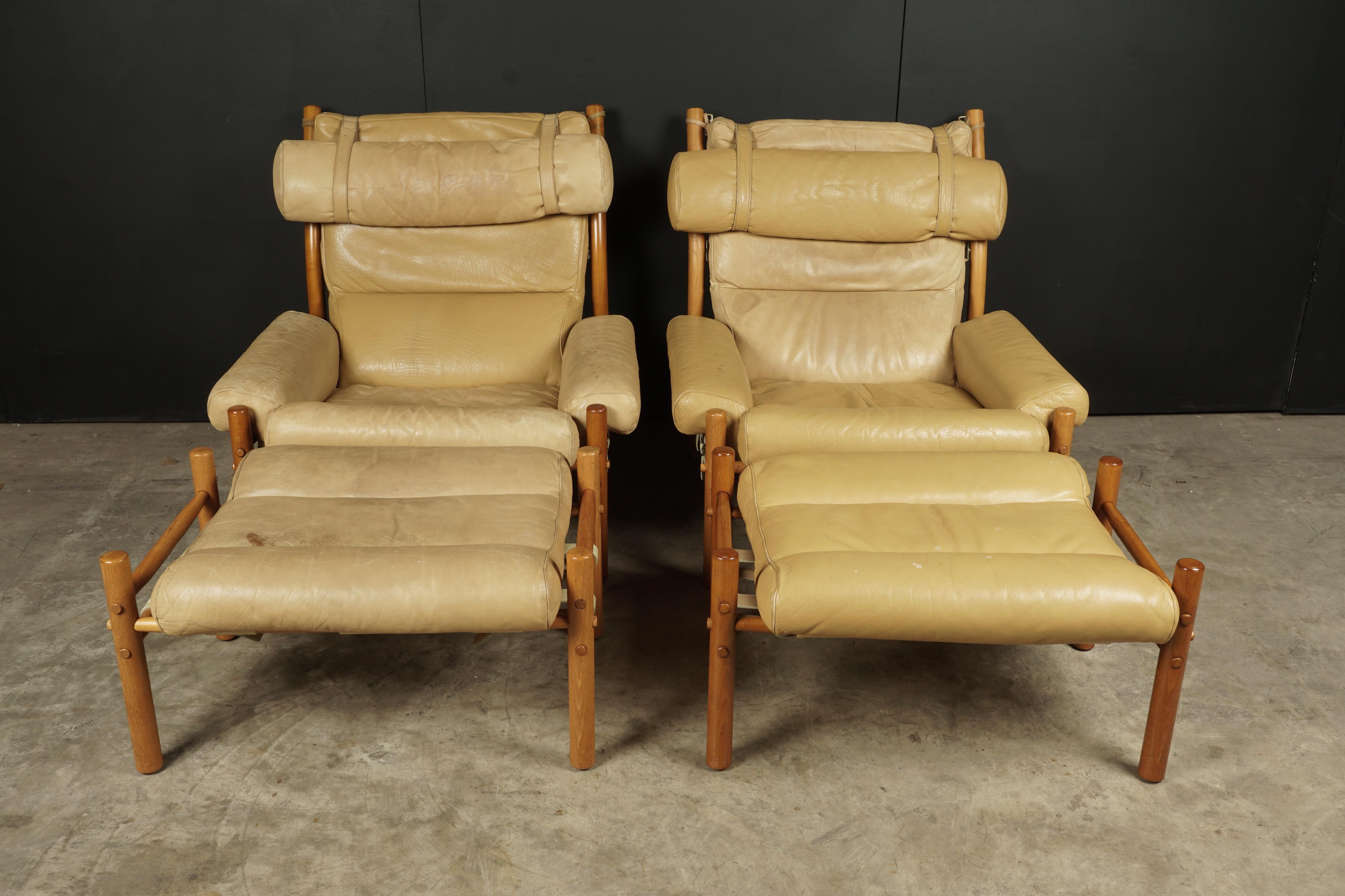 Pair of Arne Norell lounge chairs with foot stools, Model Inca, circa 1960. Original light tan leather on a solid birch frame. Produced by Arne Norell AB, Aneby Sweden.