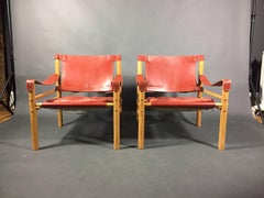 Pair of Arne Norell Red or Orange Leather Sirocco Chairs, Sweden