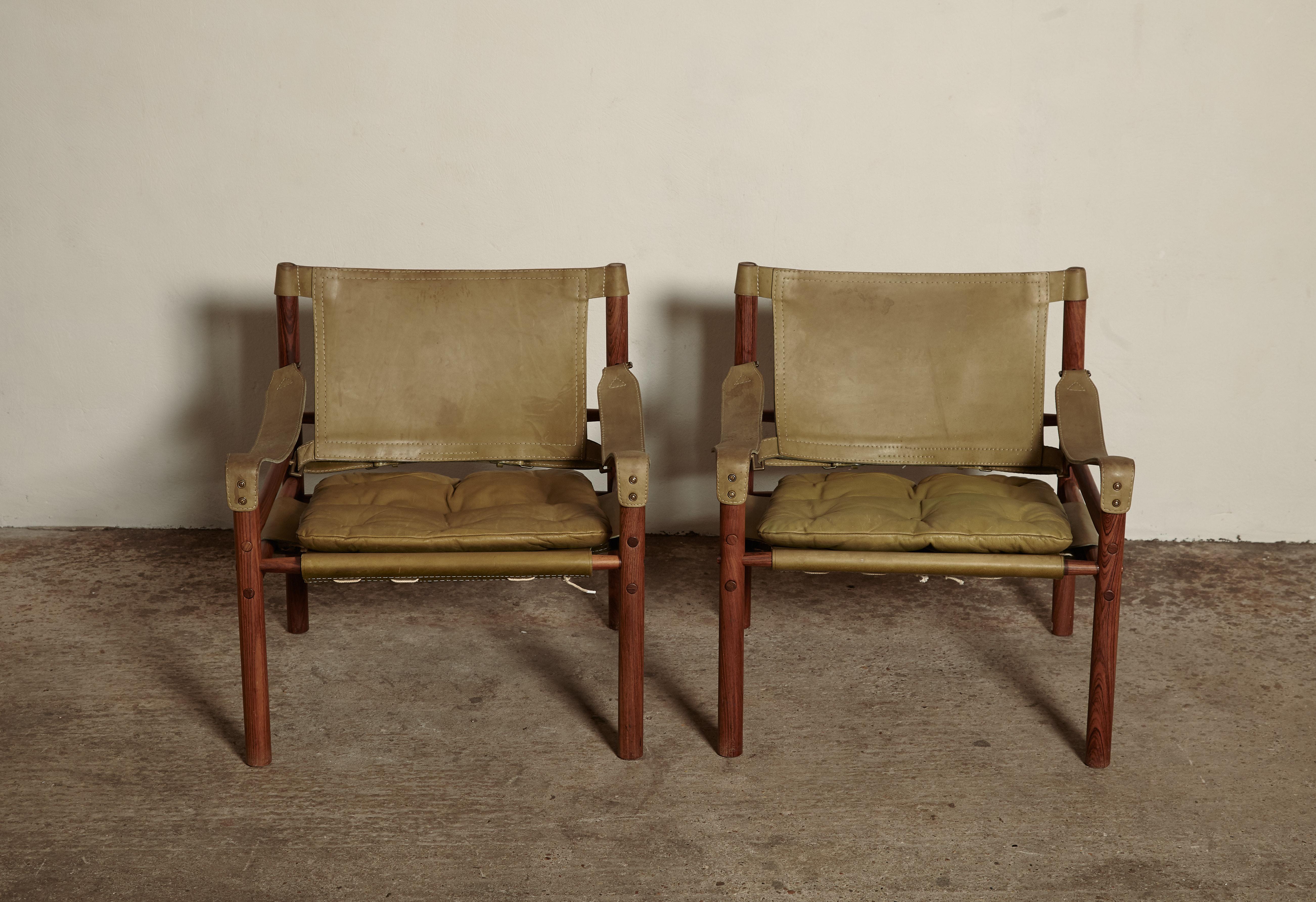 A rare authentic pair of original Arne Norell safari sirocco chairs in green leather. Made by Norell Mobler in Sweden (60s/70s) with makers label intact.

In good vintage condition, some marks and signs of wear relative to age. Frames are in great