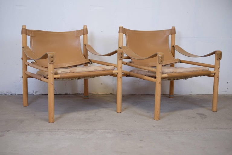 These beautiful 'Sirocco chairs' was designed by Arne Norell in 1964, Aneby Mobler, Sweden. 

The frame is constructed without any glue or screws and uses the support of slung leather, great condition. The beautiful original leather is in almost