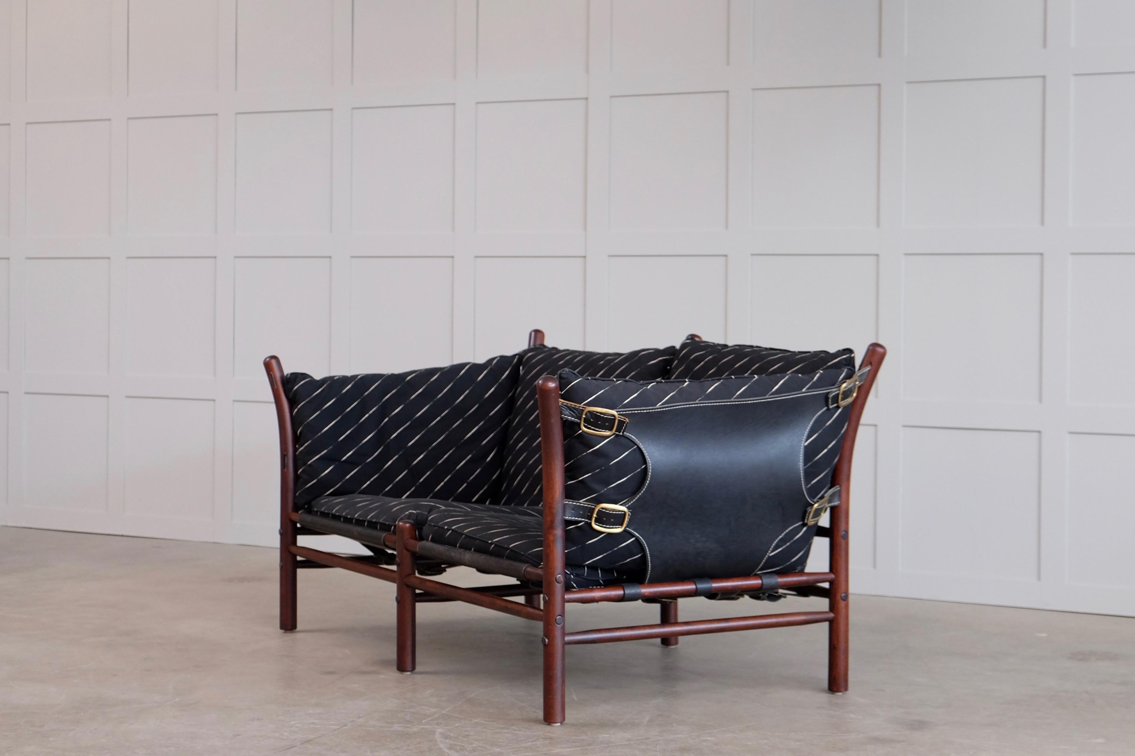 Ilona sofa designed by Arne Norell 1960s, produced by Norell Möbel AB, Sweden.
Dark stained beech, fabric, leather and brass details.
Global front door shipping, delivery within 14 days: €800