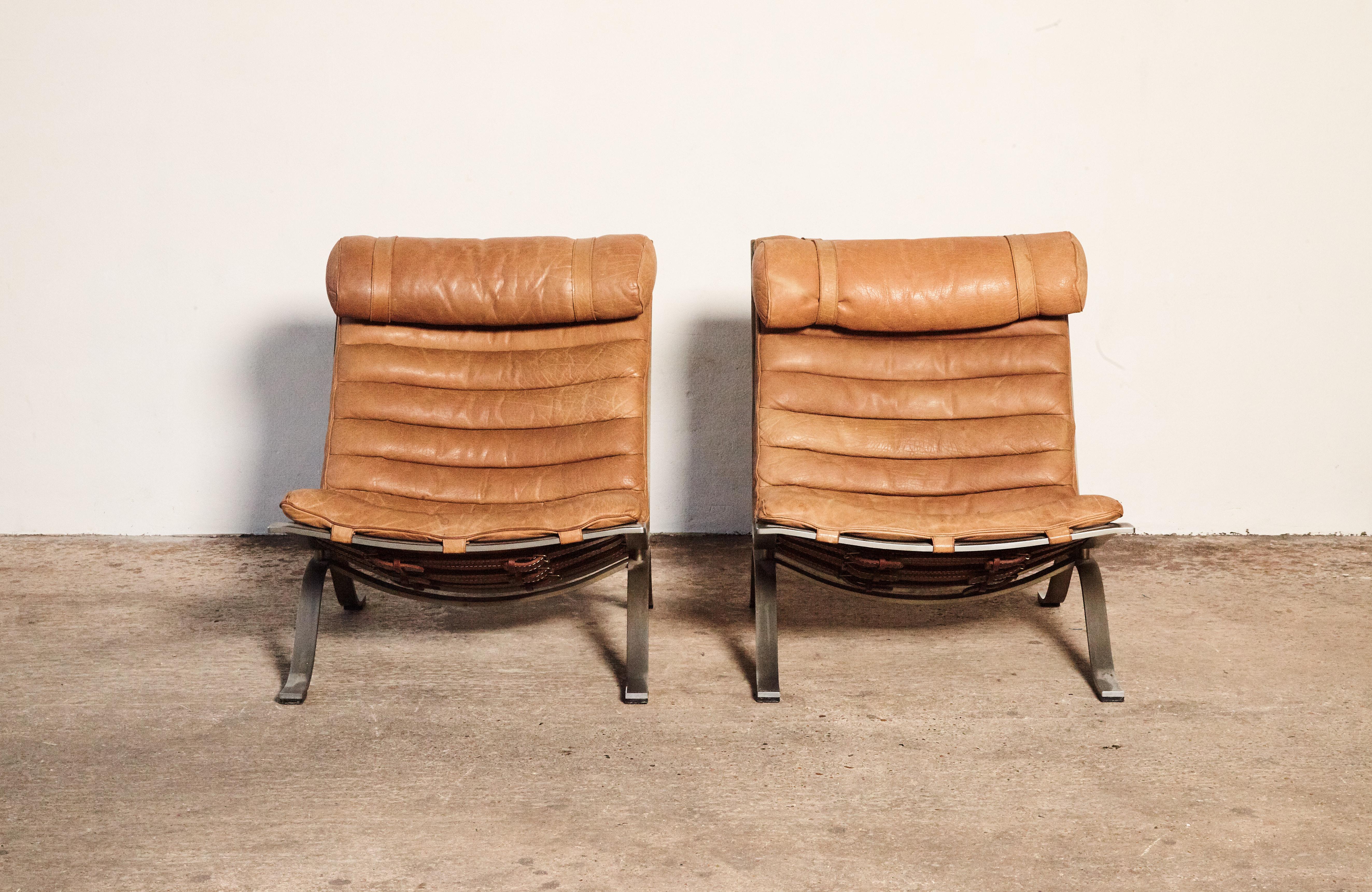 A stunning pair of Arne Norell Ari Chairs, Norell Mobler, Sweden, 1970s. In rarely seen cognac / tan buffalo leather. In great original condition. Ships worldwide.