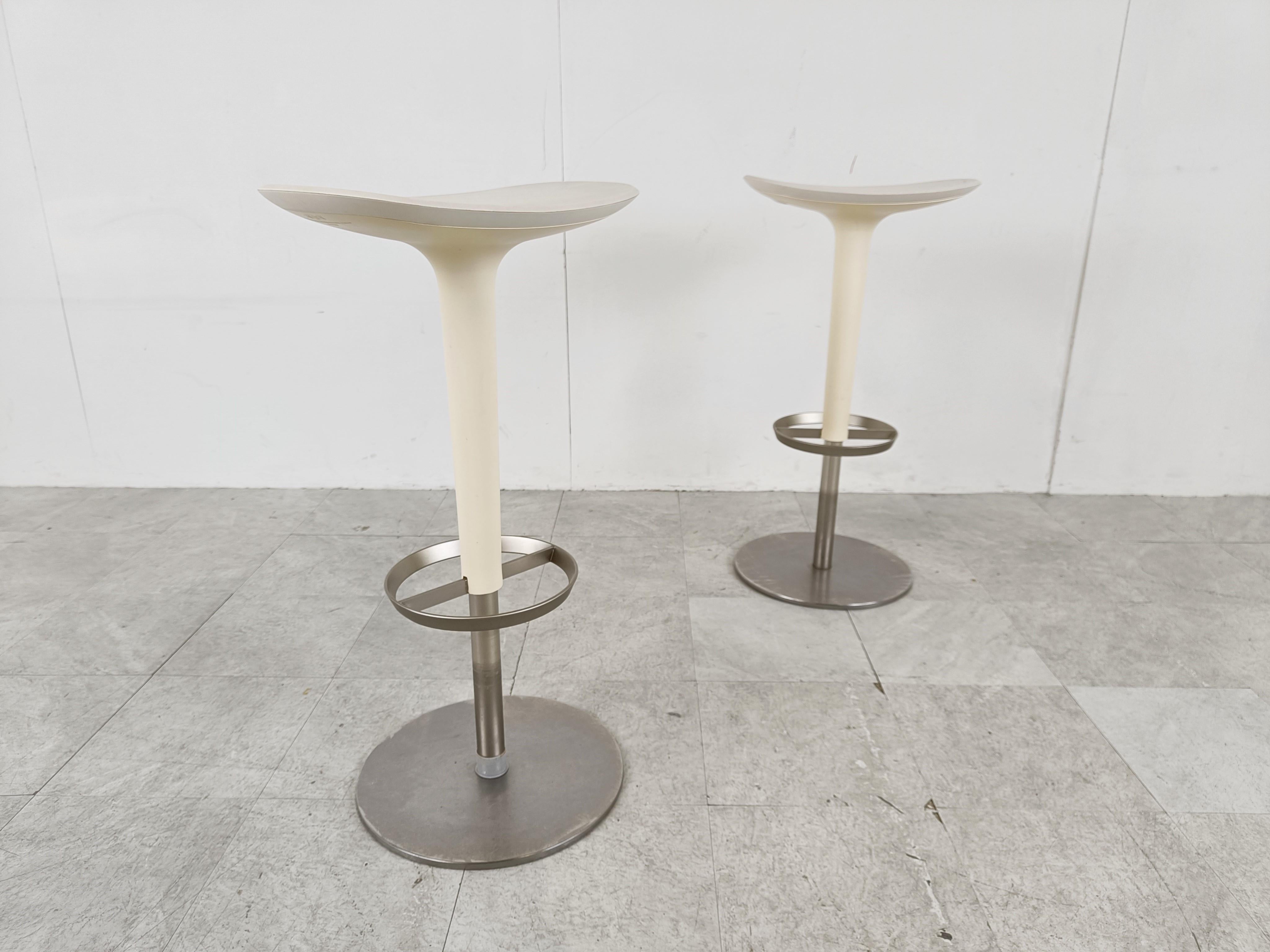 White bar stools by arper Italy.

Rings that serve as footrest and a round aluminum base.

Beautiful timeless design.

Dimensions: 
Height: 71cm/27.95