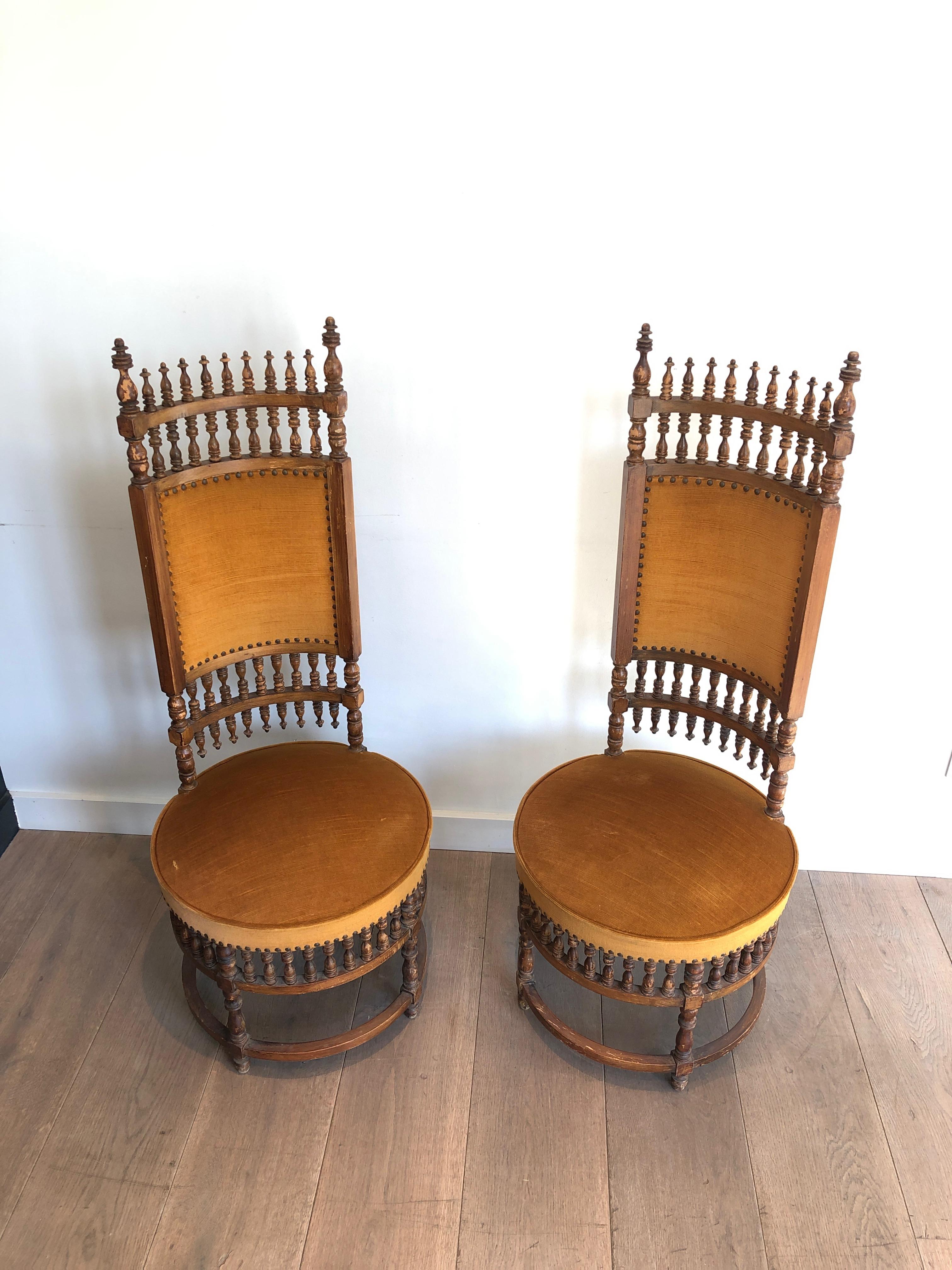 This pair of very unusual chairs is made of wood and fabric. This is an interesting Arts & Crafts work. Circa 1900
