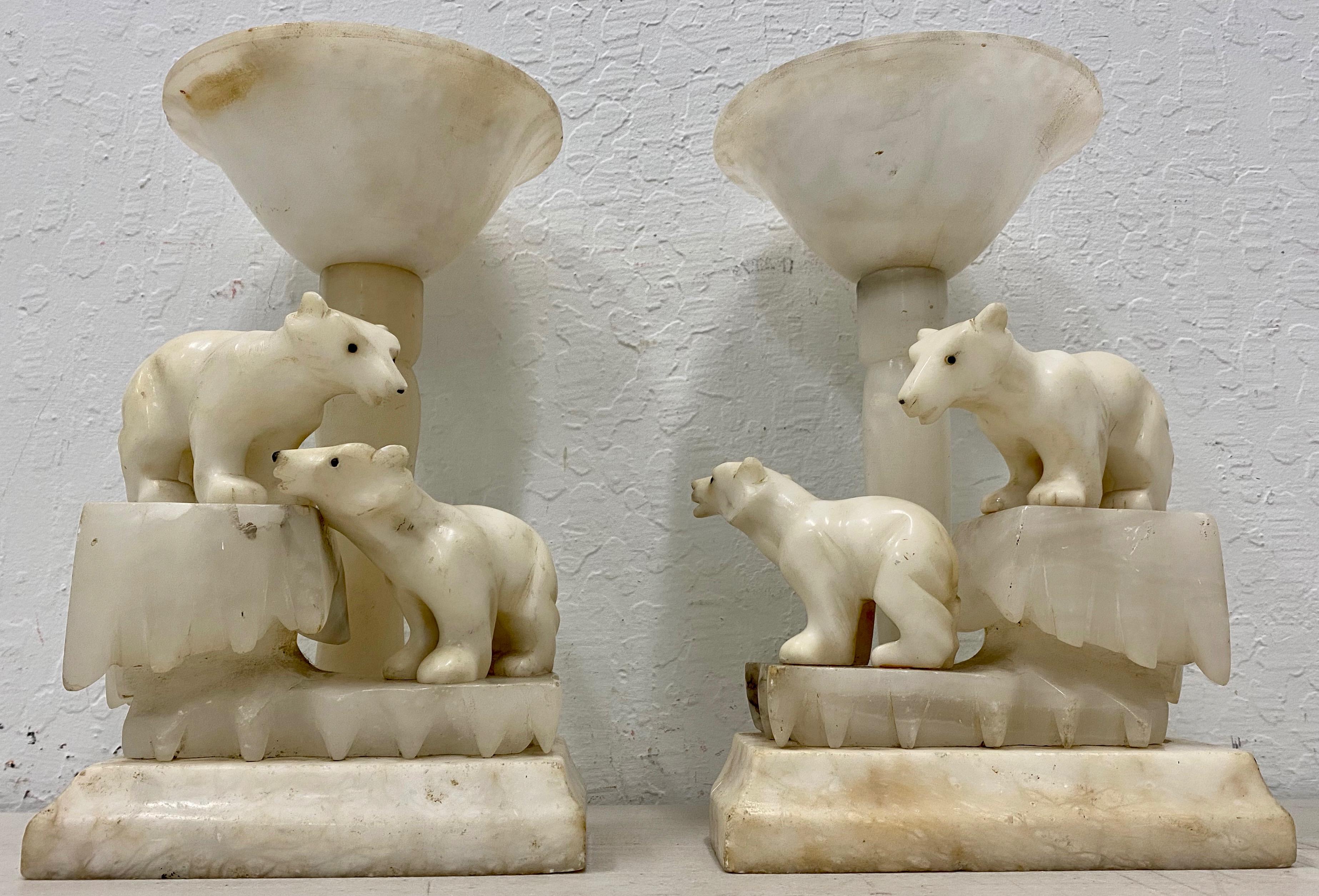 Pair of Art Deco alabaster polar bear table lamps, circa 1920s

Brilliant pair of hand carved alabaster Art Deco polar bear table lamps.

Each lamp has a unique pair of Polar Bears walking around on icebergs.

The lamps are wired and ready to