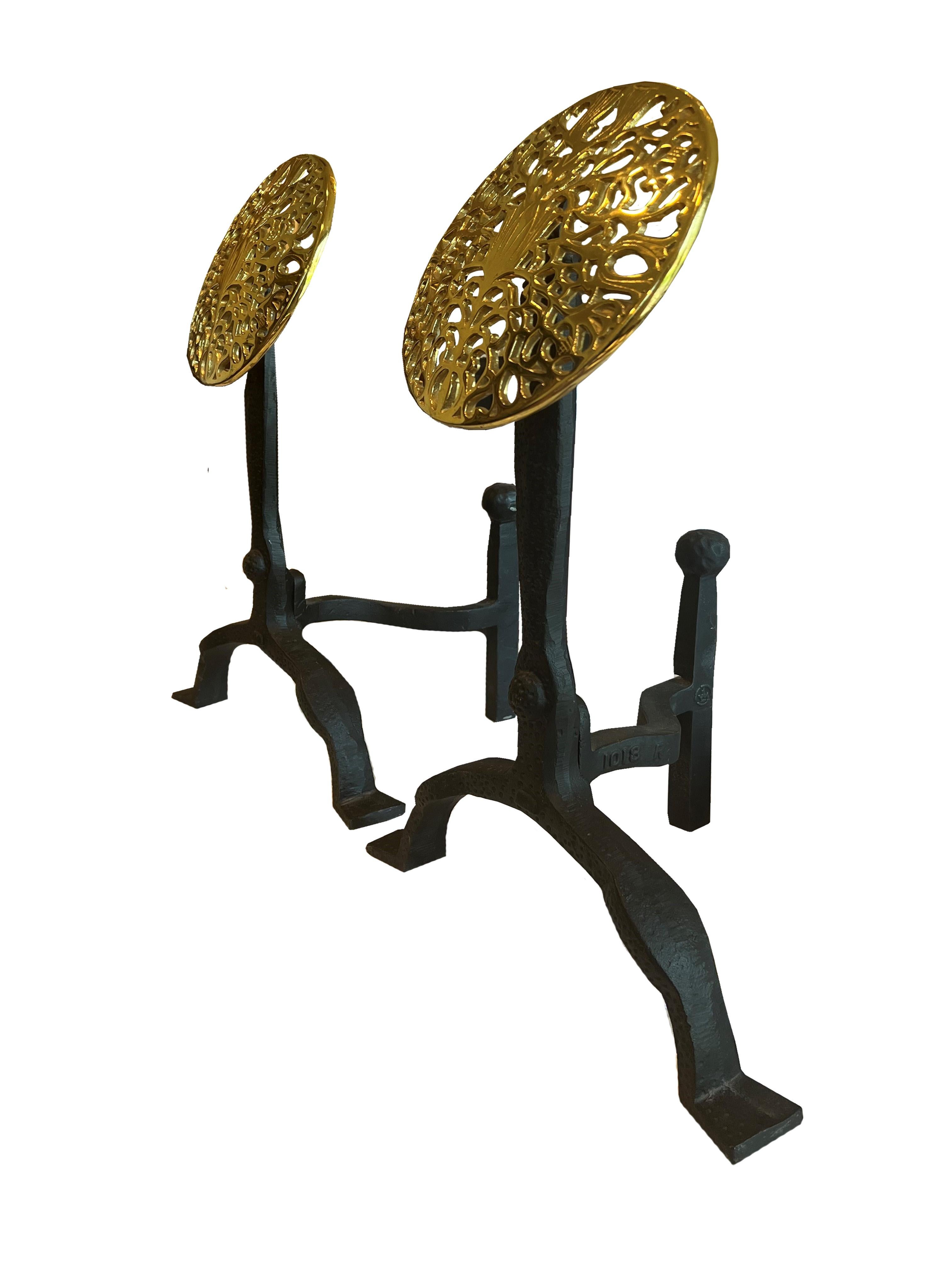 Discover the epitome of vintage charm and sophistication with this exquisite pair of Art Deco fireplace andirons, a splendid fusion of form and function. Meticulously crafted, each andiron rests on a black iron base, which boasts a hammered texture