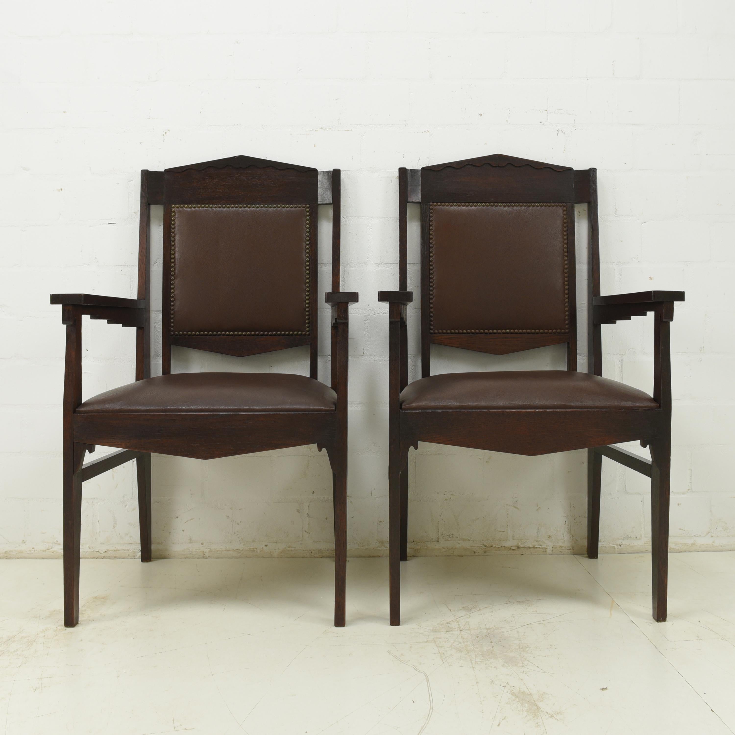 Pair of Armchairs Art Deco Solid Oak armchair desk chairs, 1925

Features:
Stable & comfortable
Faux leather upholstery like new
Geometric art deco design
Beautiful patina

Additional information:
Material: Solid oak
Dimensions: 60 W x