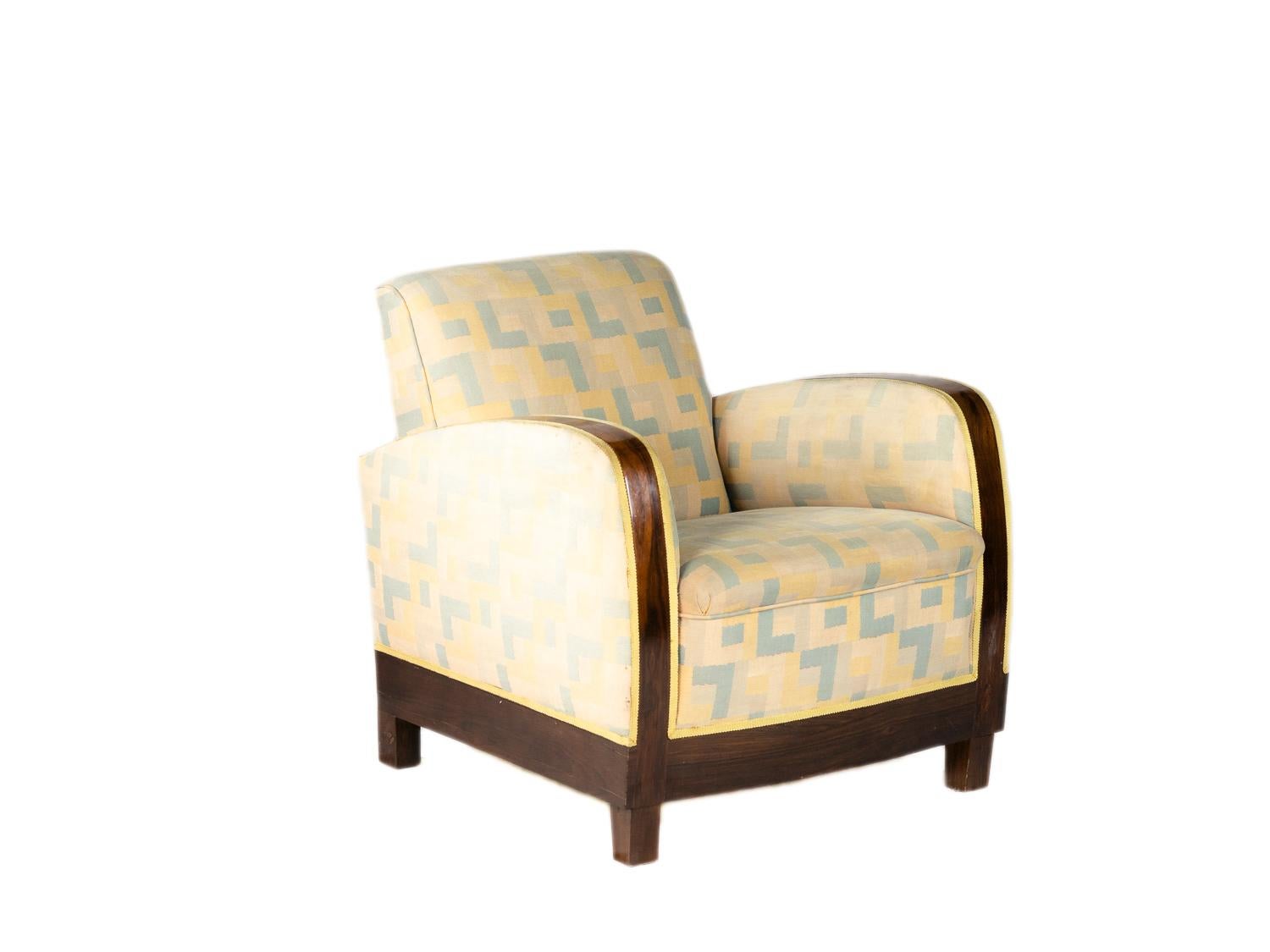 Elegant pair of varnished rosewood parquetry fauteuil sofas with elegant proportions and upholstery polychrome pattern of colors.