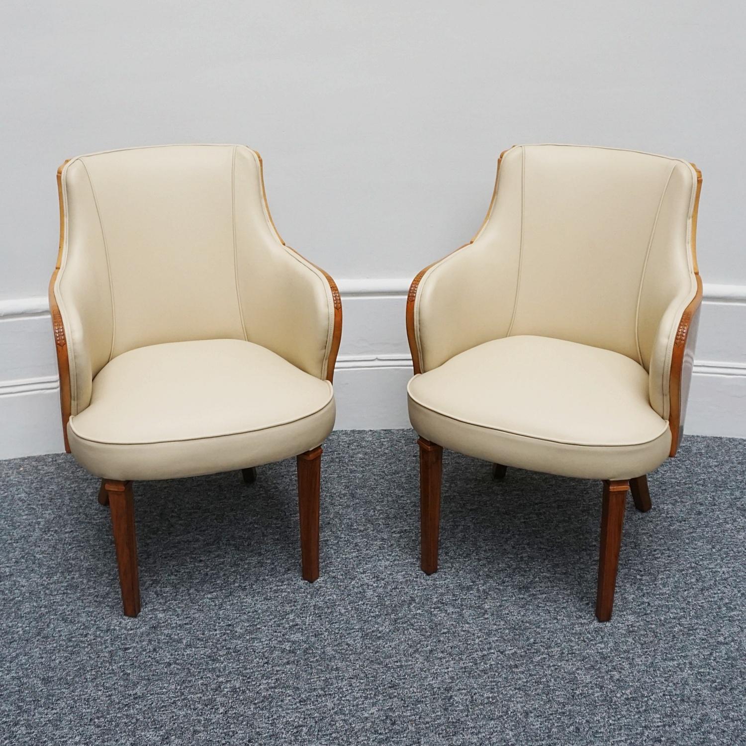 A Pair of Art Deco Armchairs by Maurice Adams. Burr walnut wrap around veneers with carved detail to arms. Solid walnut legs and frame. Re-upholstered in cream leather. 

Dimensions: H 89cm W 58cm D 56cm Seat H 44cm 

Origin: English

Date: Circa