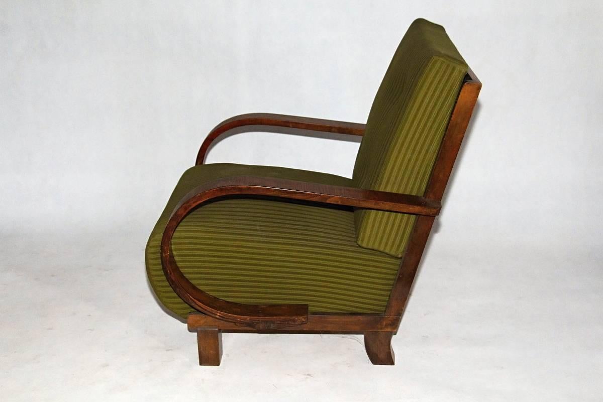 Pair of Art Deco armchairs in original upholstery, stabile construction, walnut wood, removable seat cushions.