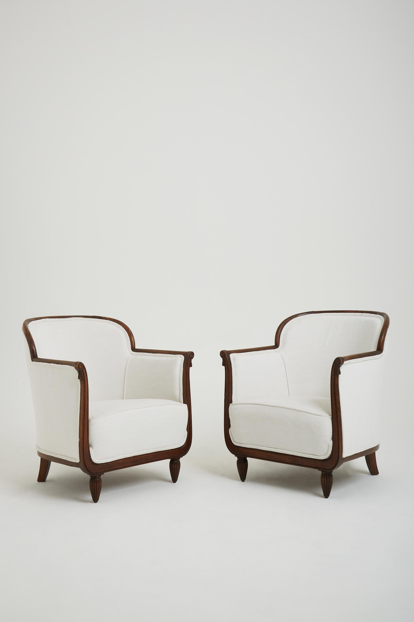 A pair of Art Deco oak armchairs, upholstered in Perennials fabric.
France, Circa 1930.
 