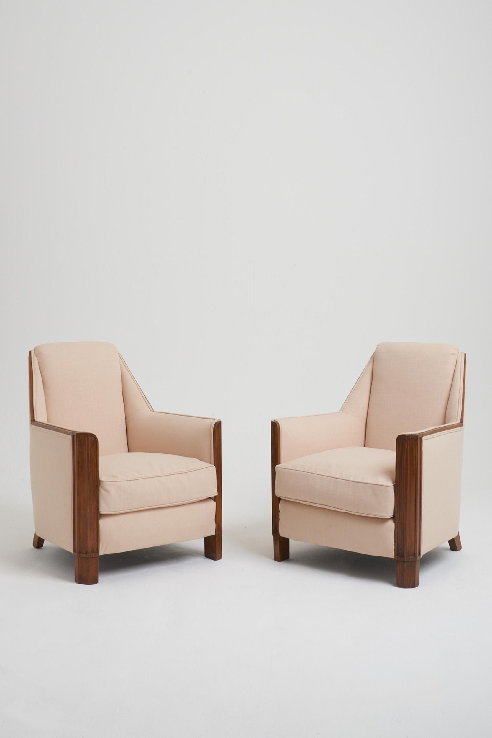 A pair of Art Deco oak armchairs, of elegant geometric design.
France, Circa 1930.