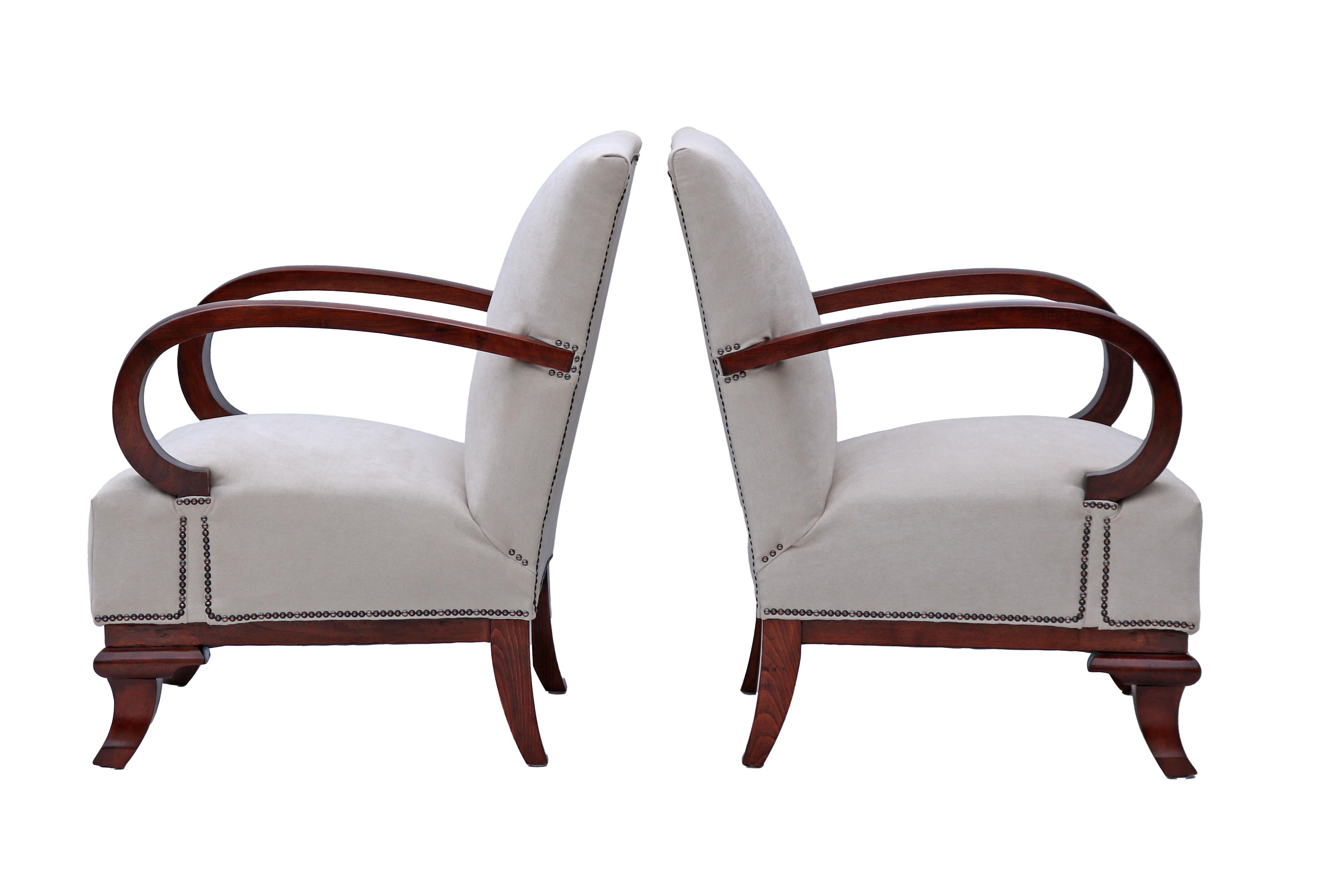 A pair of Art Deco armchairs, fully restored, designed by Lajos Kozma. These armchairs provide a very comfortable seating. Their clean and elegant look will uplift your room.