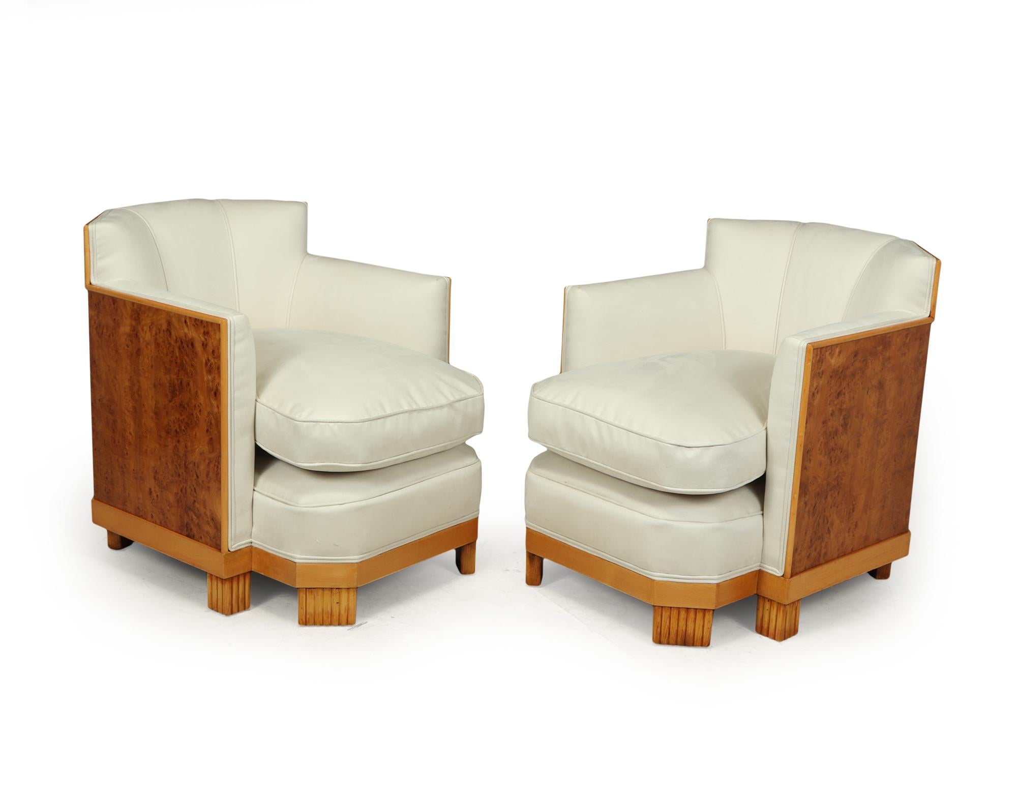 A Stunning pair of deep seated armchairs with hexagonal shaped backs having burr thuja veneers with boxwood detail, reeded feet and fully upholstered and covered in very high quality Italian Faux Suede, the cushion is down filled and deep making the