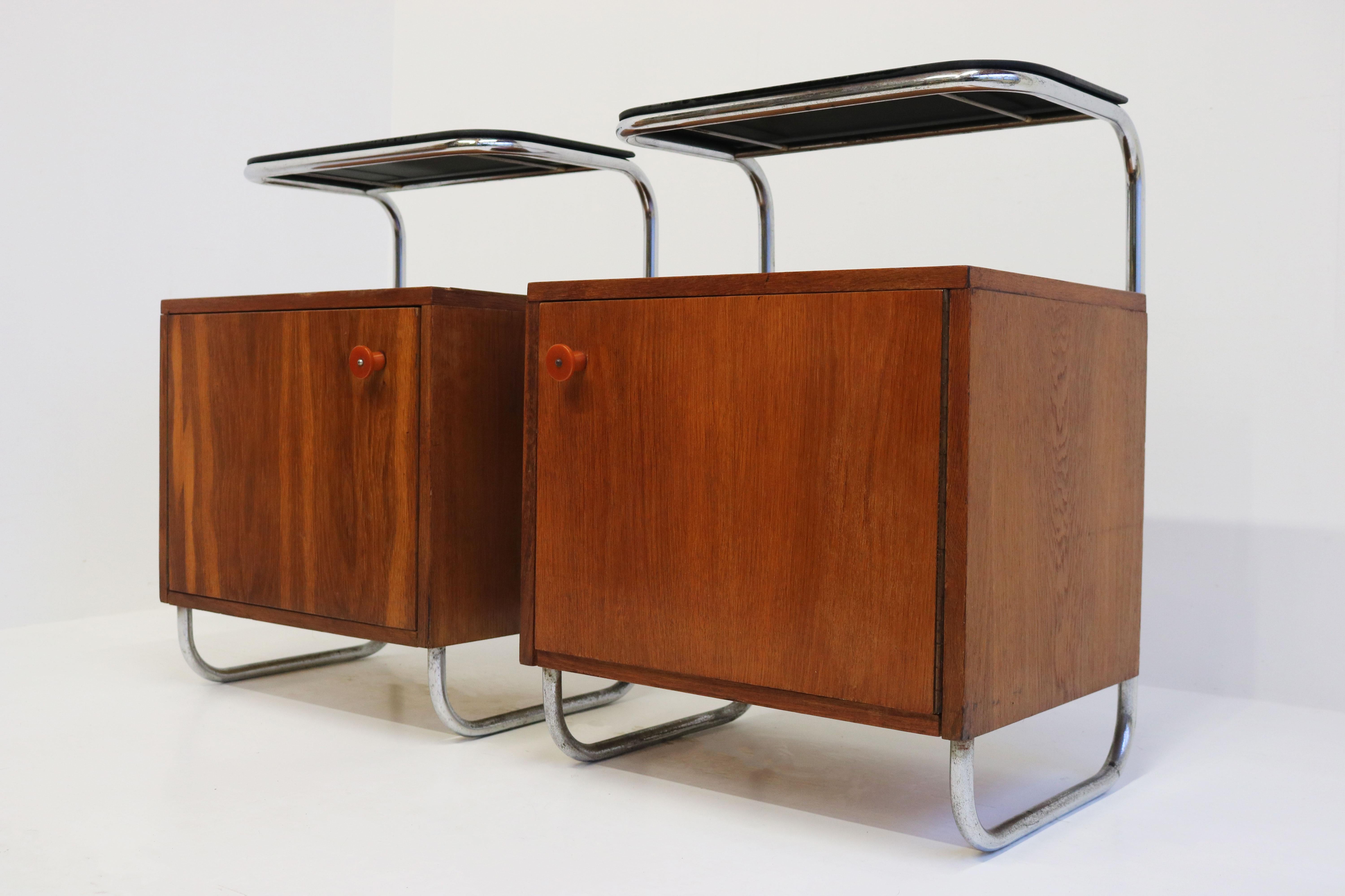 Stylish & timeless ! This rare pair of antique Art Deco German nightstands by Bauhaus 1930. 
The combination of tubular chrome frame , the warm wood grain & black glass make this Art Deco design a true classic for many years. 
The pair has its