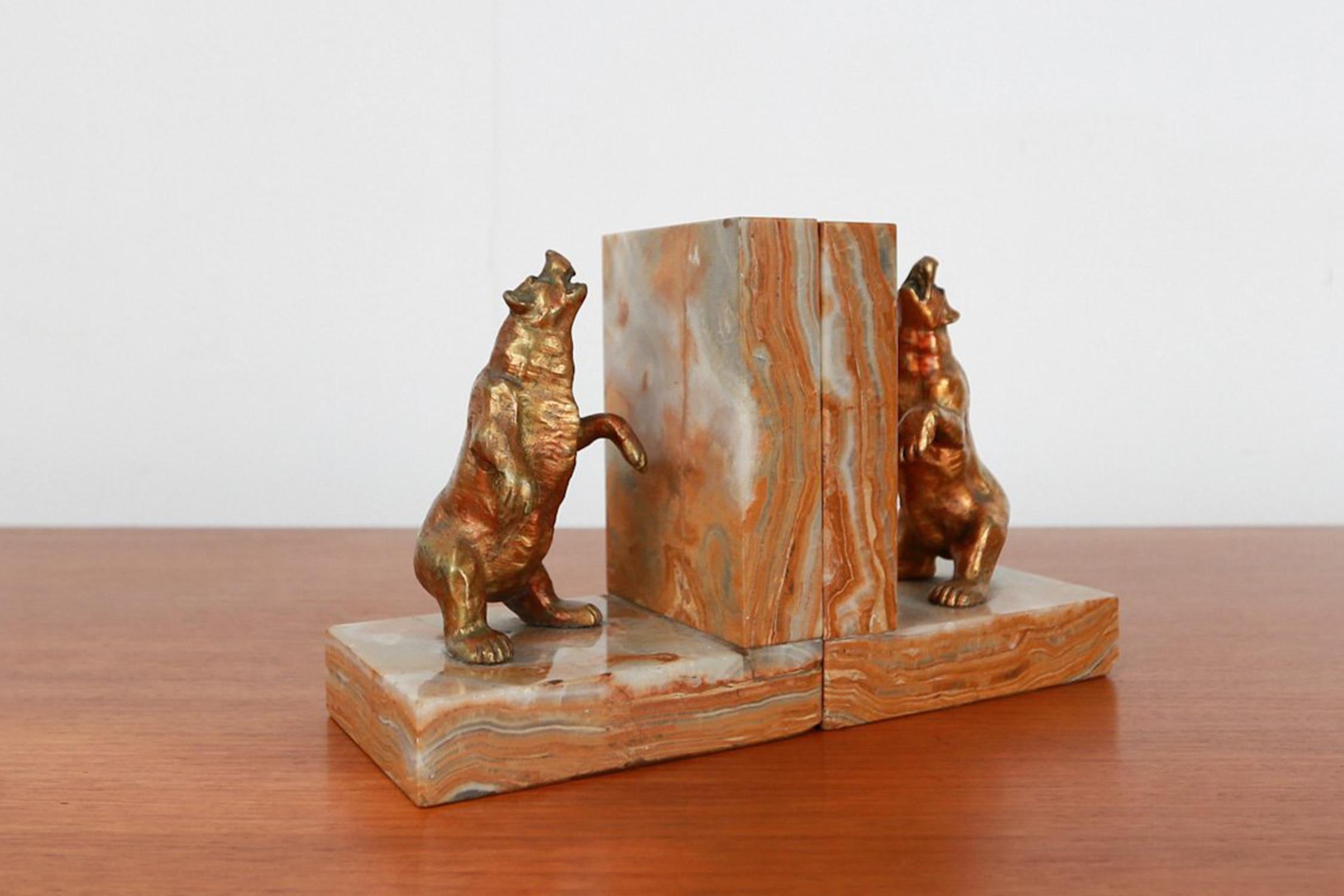 France / 1930 / bear bookends / marble, brass / Art Deco

French Art Deco bookends crafted in the 1930. Each bookend features a beautifully detailed brass bear figure, standing on his hind legs and looking at the sky, each in a slightly different
