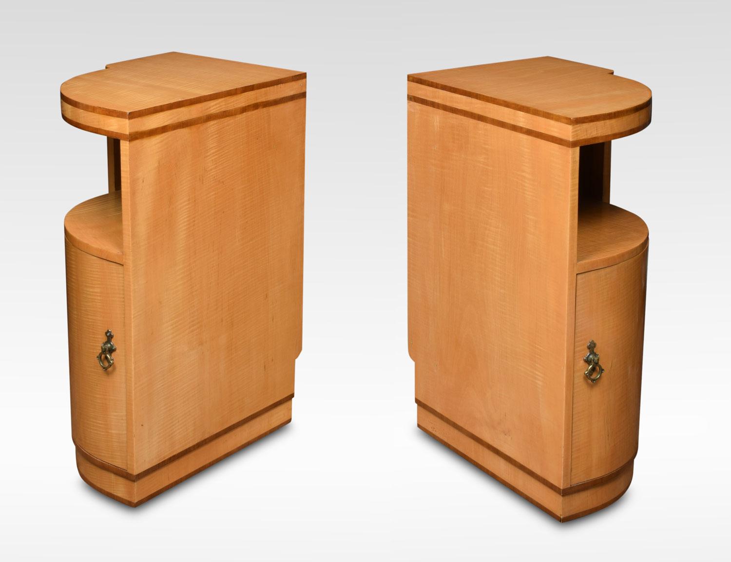 Pair of Art Deco maple and walnut banded bedside cabinets. Having curved fronts with single door opening to reveal single fixed shelf all raised up on shaped plinths.
Dimensions:
Height 30 inches
Width 14 inches
Depth 20 inches.