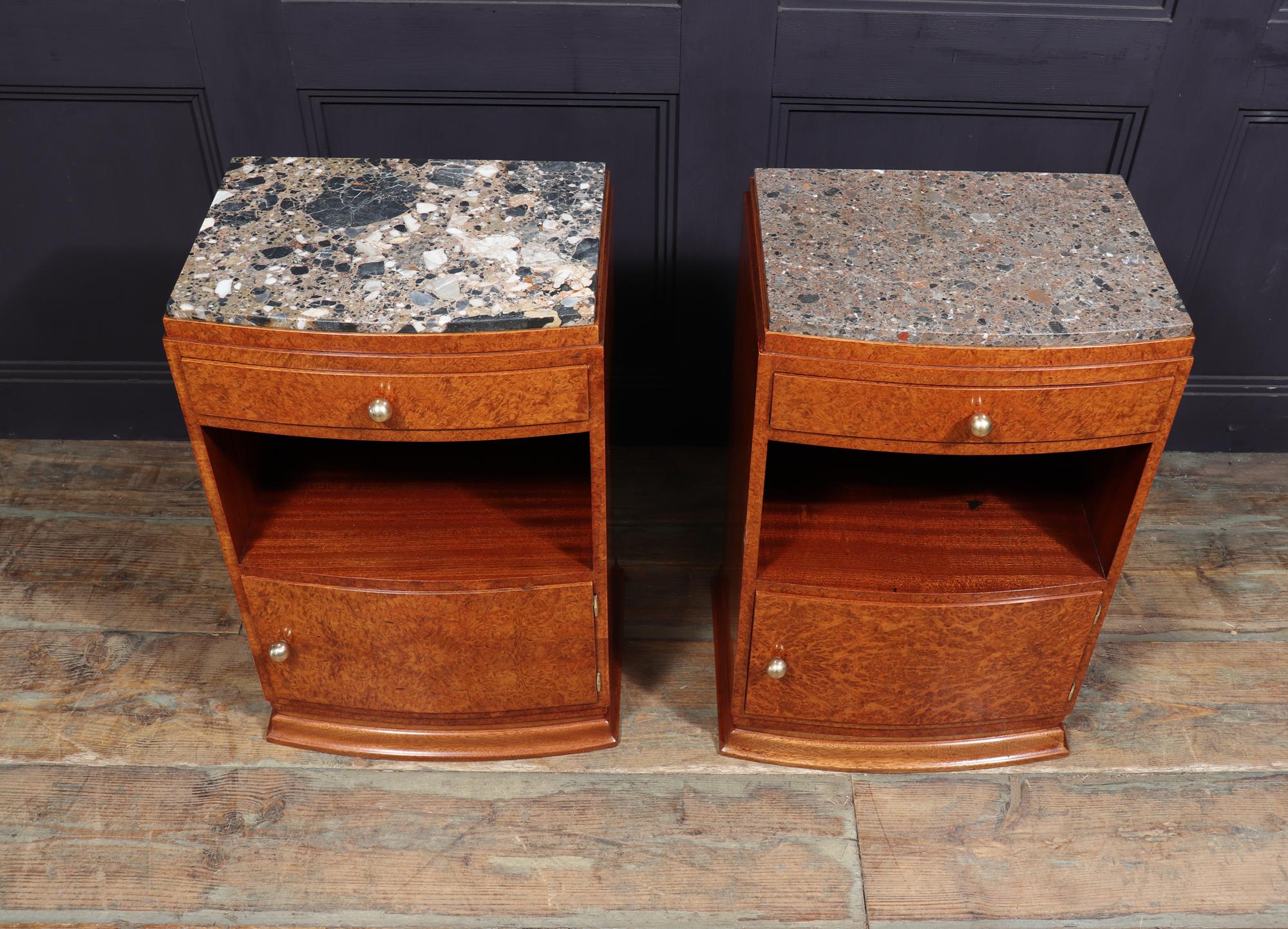 ART DECO BEDSIDE CABINETS
A pair of French bow fronted Art Deco bedside cabinets, produced in France in the mid 1920’s in Amboyna the cabinets have marble tops with single drawer below then a shelf and cupboard door below this with original bronze