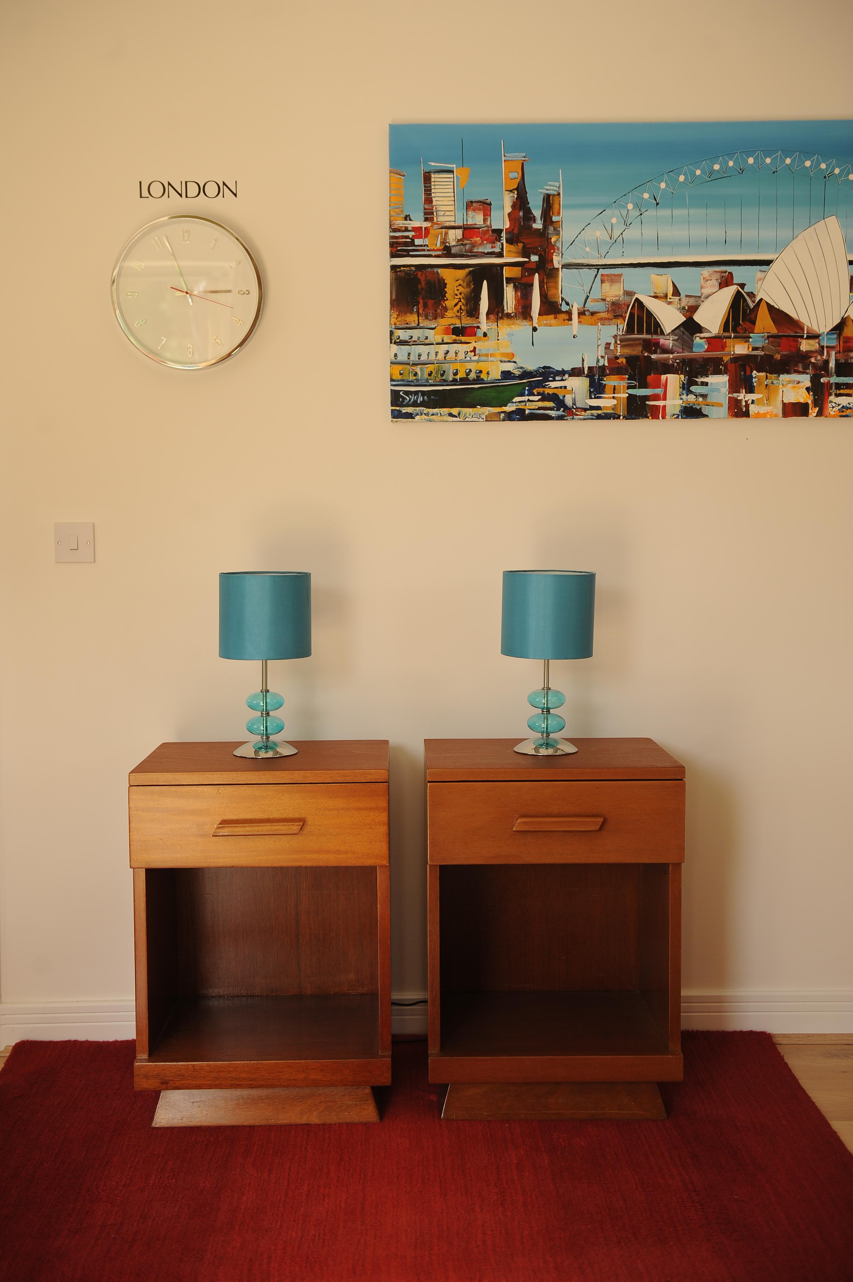 Pair of original Art Deco teak bedside cabinets / side tables with fitted drawer over open shelf, 1930s.
  