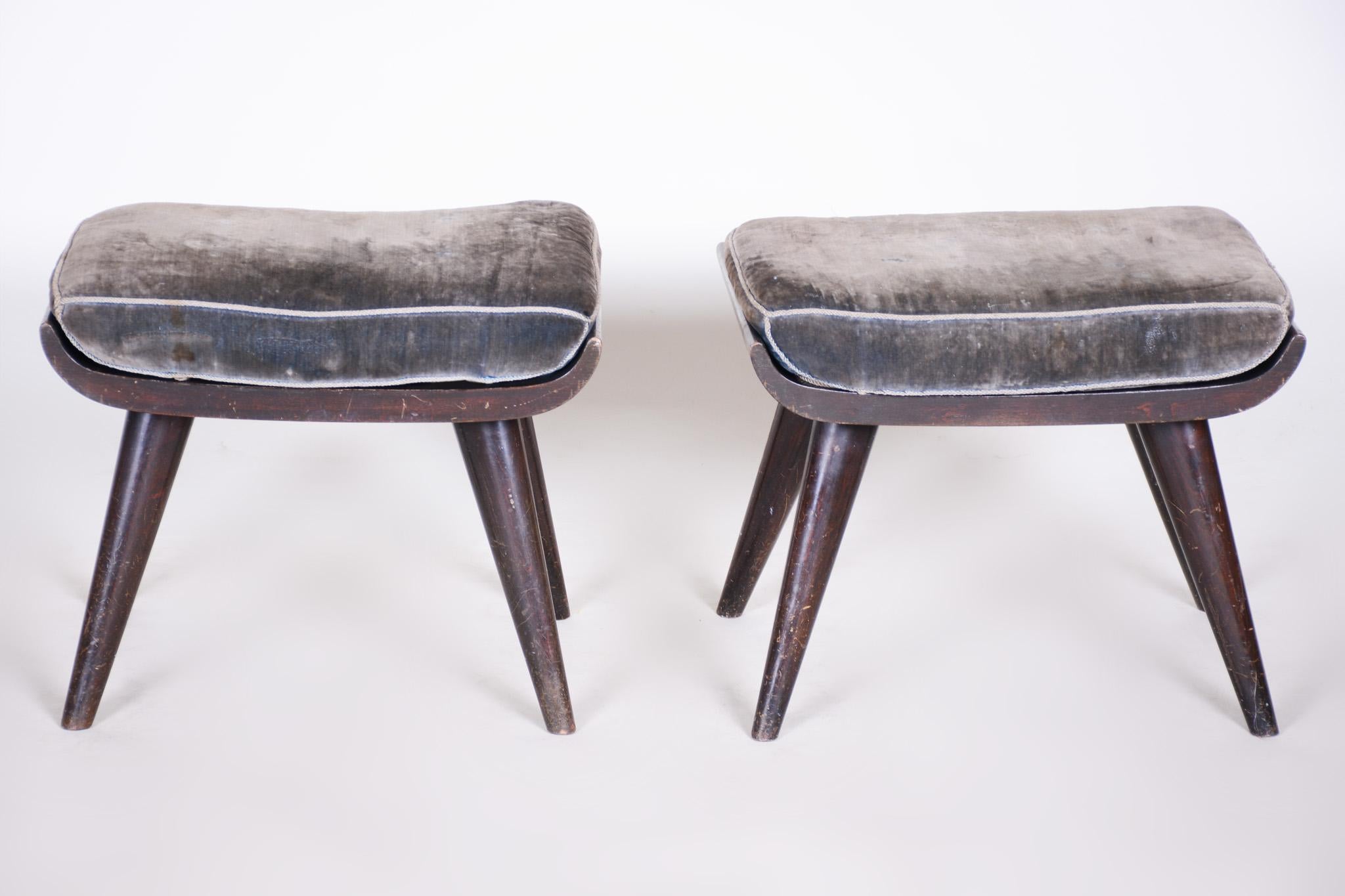Pair of original Art Deco stools 

Origin: Czechia
Period: 1920-1929
Material: Stained beech, polish 

In pristine original condition, the upholstery has been professionally cleaned, and its polish revived by our refurbishing team in Czechia.