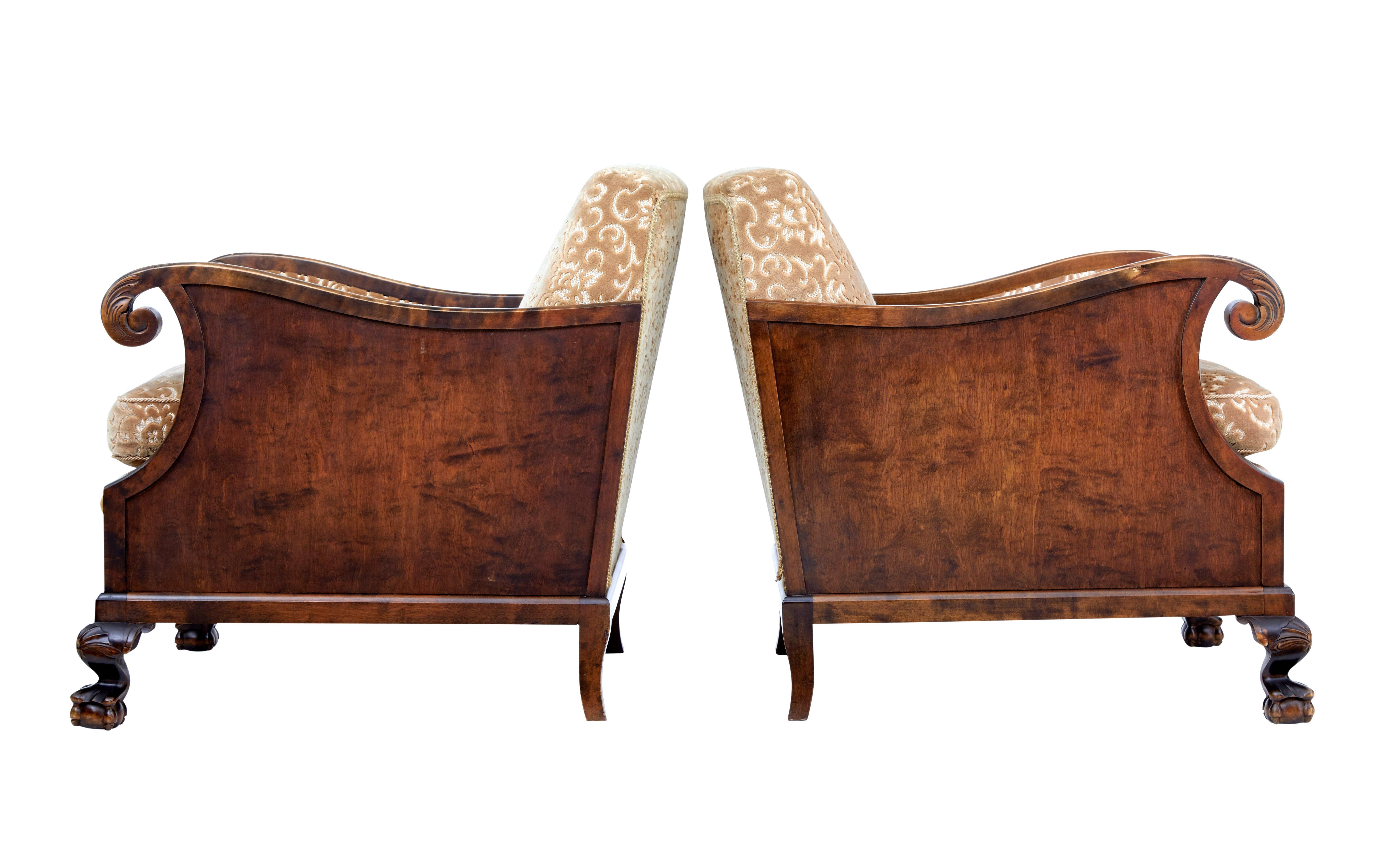 Fine pair of late Art Deco birch armchairs, circa 1940.

Elegant pair of armchairs, with scrolling arms and carved acanthus leaves to the arm. Paneled sides. Standing on ball and claw feet with shells to the knee.

Removable seat