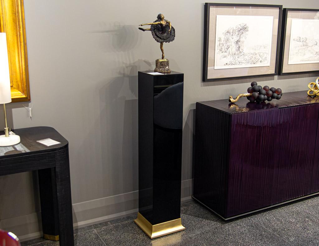 Introducing our stunning Pair of Art Deco Black Lacquer Pedestal Columns, a true masterpiece of craftsmanship and design. Made in the USA circa 1970’s, these columns have stood the test of time and have been masterfully restored to their original