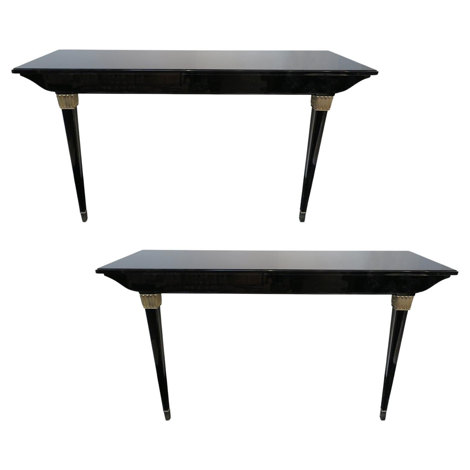 Pair of Art Deco Black Lacquer Wall Mounted Consoles with Brass Accents For Sale