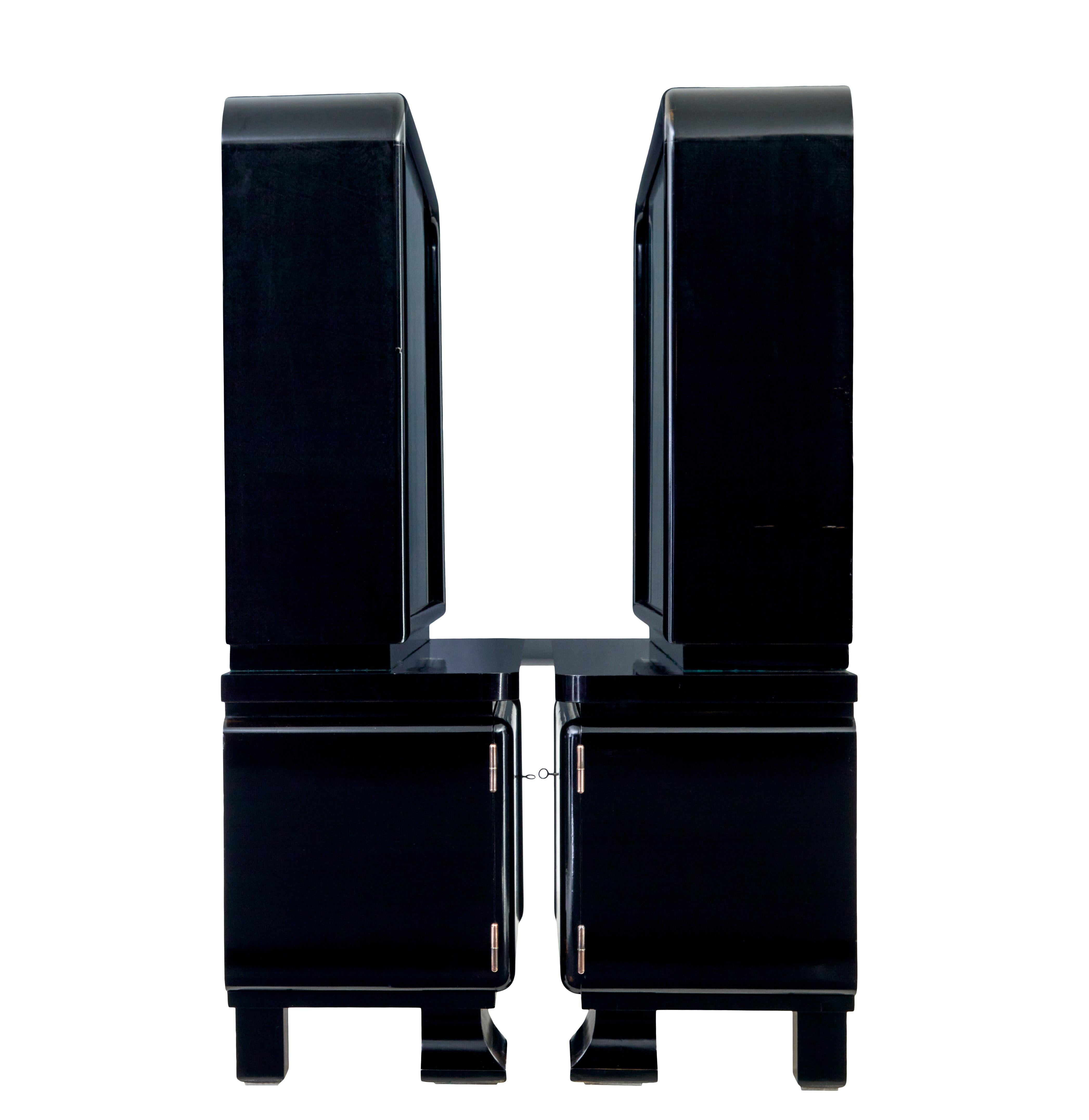 Glass Pair of art deco black lacquered glazed cabinets For Sale