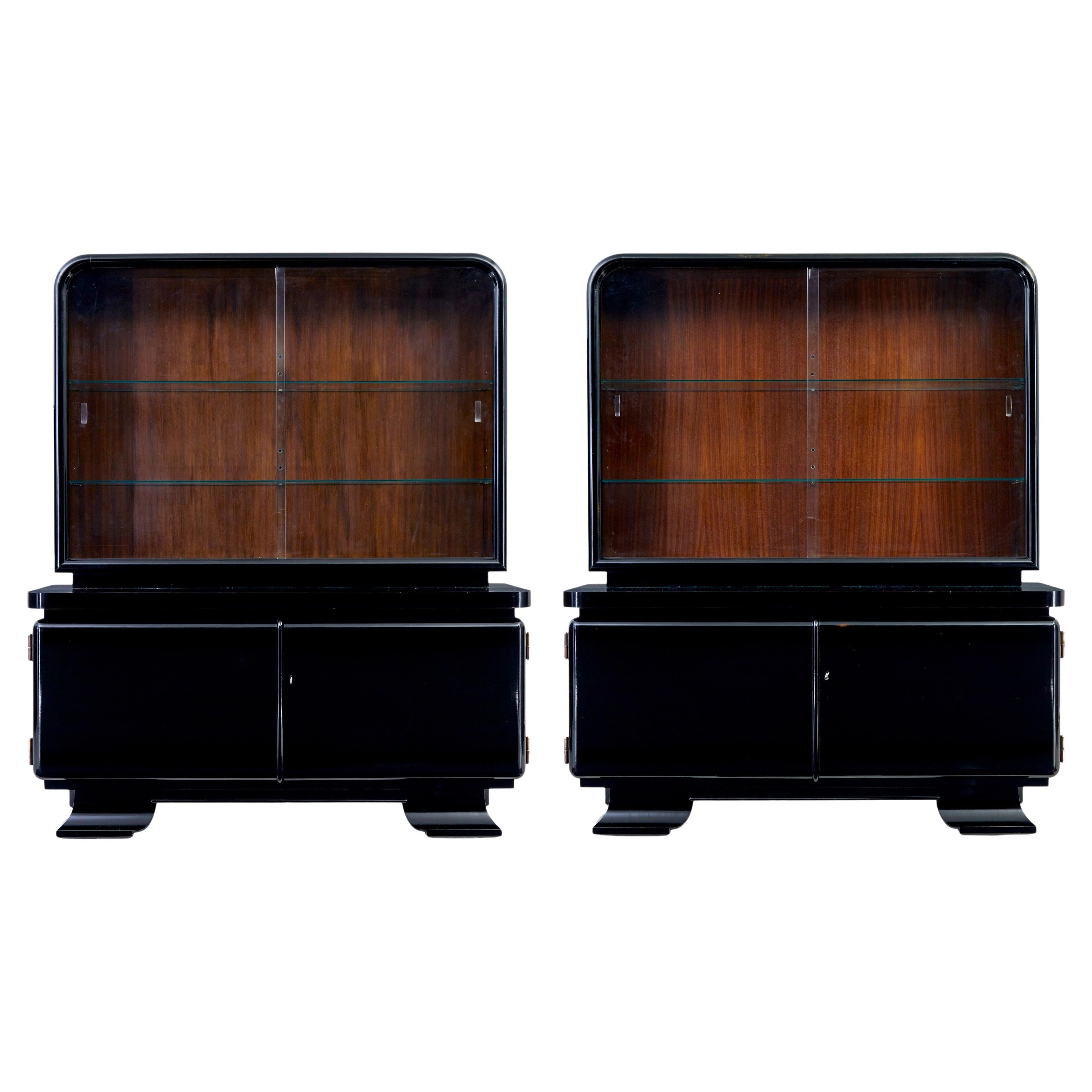 Pair of art deco black lacquered glazed cabinets For Sale