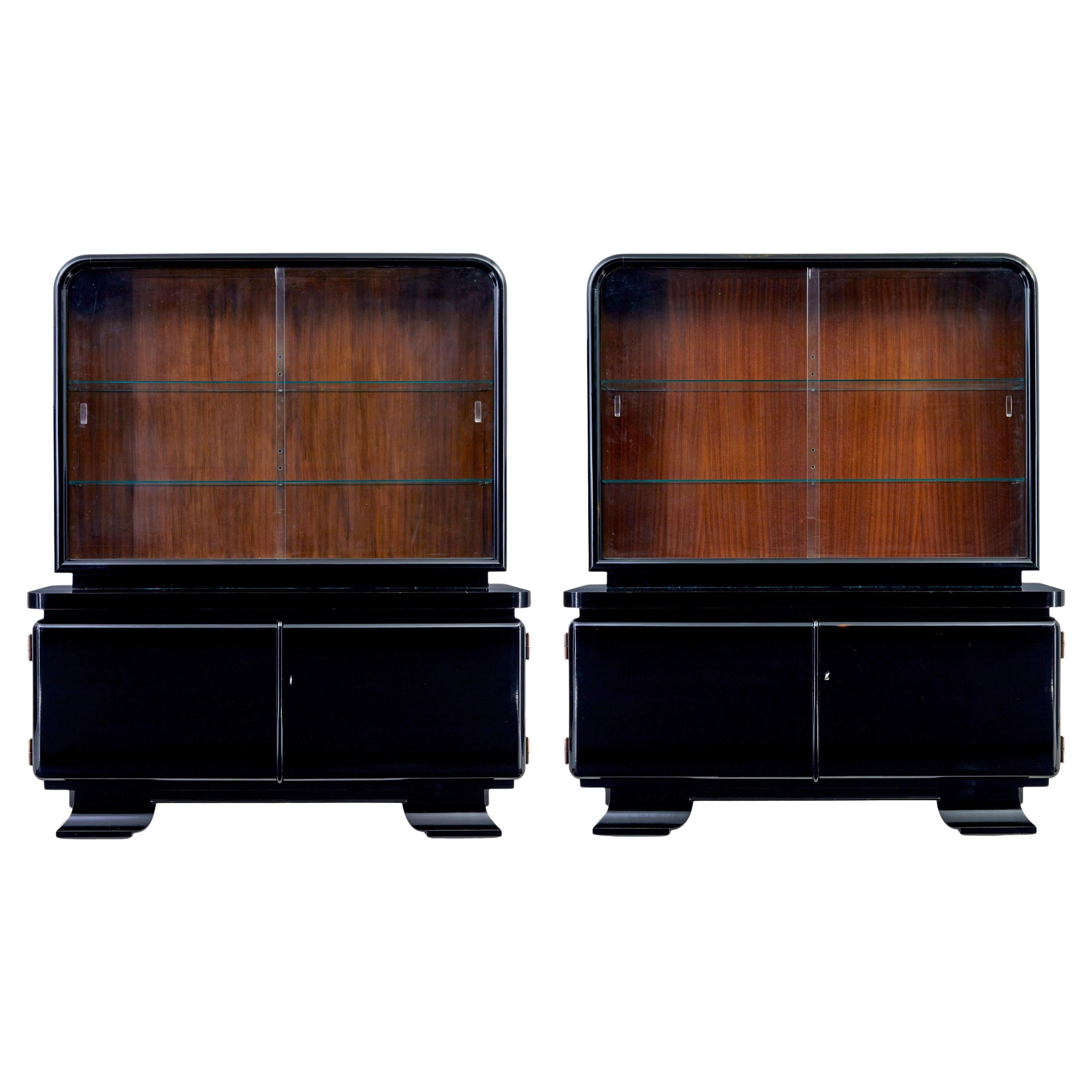 Coppia di vetrine art déco laccate di nero e smaltate